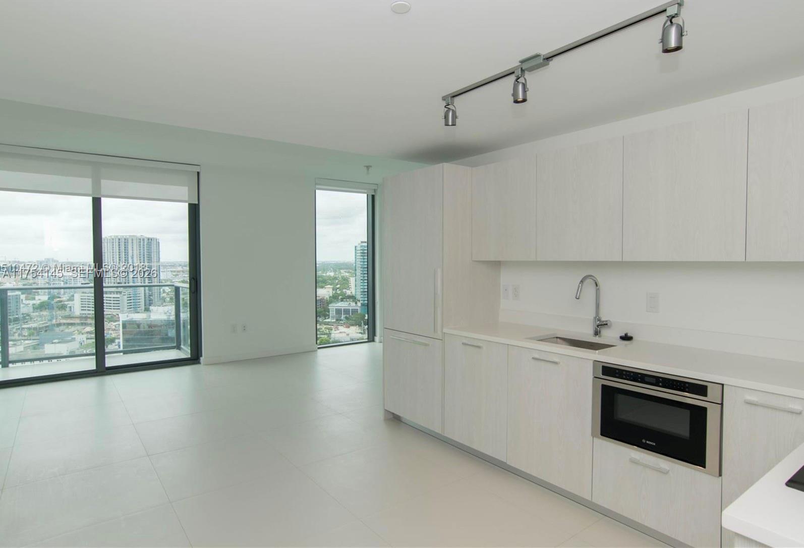 Spacious 2Bed/2Bath with high-end custom-made closets and window treatments. Best floor plan in the building! Enjoy luxurious 5-star amenities including a gym & spa, lounge, party room, billiard room, movie theater, children's playroom, business center, two swimming pools, jacuzzi, and tennis court. The property features Bayfront Park with docks and a boardwalk, along with access to a private beach club and restaurant. Prime location just minutes from the Beaches, Design District, Wynwood, Downtown, and Brickell. A must-see! Ideal for investors