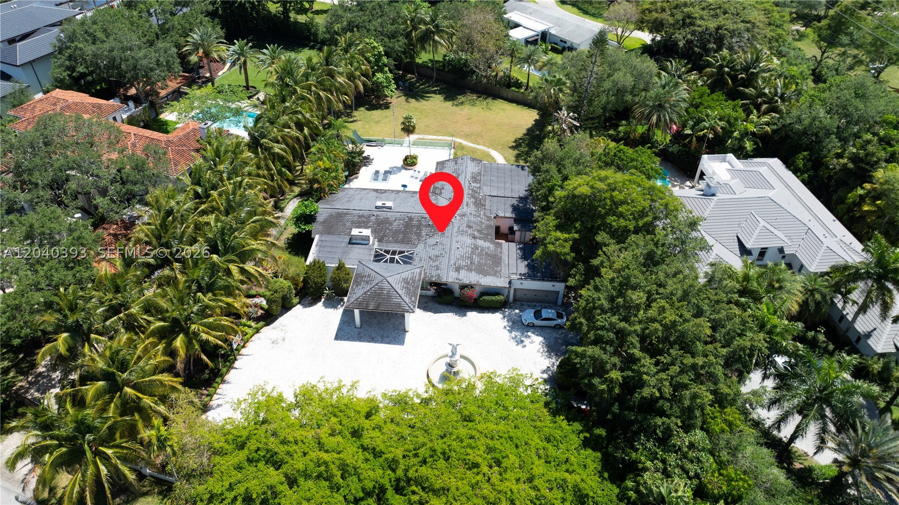 Experience modern luxury in this stunning Pinecrest estate, privately situated on a sprawling one-acre lot along a quiet, tree-lined street. Completely reimagined with exceptional craftsmanship and contemporary design, this residence offers the perfect blend of sophistication, comfort & resort-style living. Thoughtfully renovated with premium finishes throughout, the home features expansive living spaces bathed in natural light, floor-to-ceiling commercial-grade impact glass& seamless indoor-outdoor integration. At the heart of the home, a sleek designer kitchen opens effortlessly to the main living &entertaining areas, all overlooking the spectacular glass-tile pool &lush private grounds. Designed for both relaxation& entertaining, the residence boasts an extraordinary custom home theater, delivering a true cinematic experience without ever leaving home. The thoughtfully designed floor plan includes luxurious primary suite, offering spa-inspired bathroom& generous custom closets, along with two additional guest bedrooms for family and visitors. The gated property offers exceptional privacy&security, complemented by a two-car garage and expansive grounds with endless possibilities for outdoor enjoyment. Surrounded by mature landscaping & located within minutes of Pinecrest's top-rated schools, parks, fine dining, and premier shopping, this is a rare opportunity to own a turnkey estate in one of South Florida's most prestigious neighborhoods.