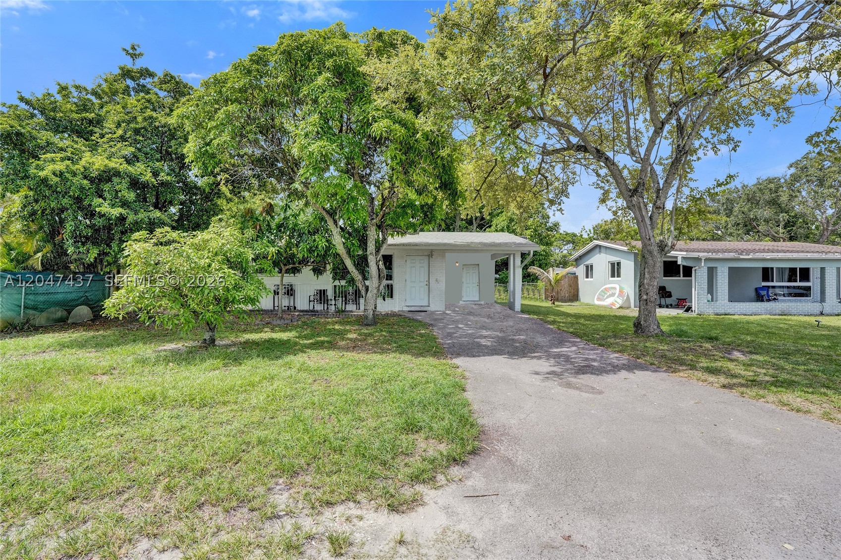 Opportunity awaits! This 2-bedroom, 1-bath single-family home offers 1,004 sq. ft. of living space and is situated on a spacious lot in a convenient Miramar location. Major updates have already been completed, including a 2023 roof, 2023 HVAC system, and impact windows and doors, providing peace of mind for the new owner. The interior is ready for your personal touch and renovations, making it an excellent opportunity for homeowners looking to customize their space or investors seeking their next project. Additional features include a covered carport, extended driveway, and easy access to the Florida Turnpike, shopping, dining, schools, and more. Don't miss the chance to transform this property into something special! 
Please not all photo's have been edited to remove furniture and personal belongings.