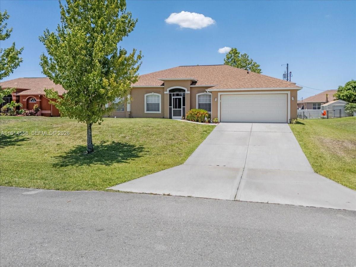 LOCATION-LOCATION-LOCATION, Priced to sell, this move-in ready 3-bedroom + DEN, 2-bathroom POOL HOME which offers incredible value with NO HOA fees or flood insurance. Enjoy unparalleled space and privacy on a double lot that runs from street to street. The interior features a dedicated den, formal living and dining rooms, family room, and a chef's kitchen with stainless steel appliances. Step outside to your private, screened-in pool—the perfect oasis for Florida living.  A second home can be built on the property. The property also includes a concrete RV pad with hookups. Located near Fort Myers, you're minutes from pristine beaches and the airport. Well maintained and ready to move in.