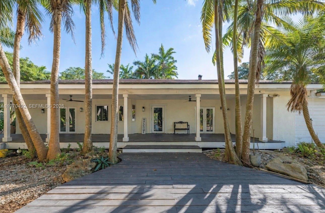 NORTH REDLAND ON 2.55 ACRES SITS AN AMAZING AG EXEMPT COMPOUND. A 4/2 FARM HOUSE W/WRAP AROUND PORCH, 6 CAR GARAGE, A SALOON OUT OF WILD WEST, 1/1 IN LAW, INCOME GROVE , & POLE BARN. SHES PRIVATE, UNSEEN FROM THE STREET,  A LONG MEANDERING DRIVEWAY LEADING YOU TO THE HOME THRU THE LYCHEE GROVE, FENCED W SERVICE ENTRY, BACKS UP TO AN CANAL. THE MAIN HOUSE IS A 4/2 GREAT ROOM WITH A WOOD BURNING FIREPLACE. THE PIECE DE RESISTANCE IS THE 3/4 WIDE WRAP AROUND PORCH W/ NEW FANS & CUSTOM LIGHTING. EVERY ROOM OPENS ONTO THE WRAP PORCH..IALL BACKING UP TO A FISHABLE CANAL. ALL NEW IMPACT DOORS & WINDOWS, STEEL FRAME CONSTR, 65 LYCHEE TREE'S, 13 BANANA TREE'S, 4 DRAGON FRUIT, AVOCADO, MANGO, STAR FRUIT, LONGAN TREE'S. THERE IS POWER TO GATE IF ELECTRIC ENTRY IS DESIRED. WELL WORTH THE VISIT. EASY SHOW  SELLER  IS NEGIOTABLE AND WILL CREDIT TOWARDS ROOF AKA IMPROVEMENTS OR CLOSING COSTS. PAVED ROADS, NORTH SOUTH FRONTAGE.. CLOSE TO KENDALL AND THE FL KEYES. LOCATED BETWEEN 2 NATIONAL PARKS BISCAYNE AND THE EVERGLADES. THIS  IS A BEAUTY