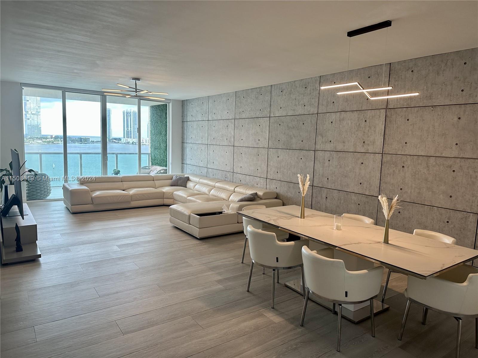 This beautiful Upgraded and Remodeled 2 beds+closed den unit offers one of the largest floor plans in the building, 2020 ft² with high ceilings and impact windows. The unit features porcelain floors, electric fireplace, luxury Italian free floating glass doors, a newer AC, costume-LED lighting, walk-in laundry room, and a custom-made Italian kitchen that is equipped with appliances from Bosch, high-end coffee maker, and a wine cooler. Must not forget about the breathtaking view of the water and marina, making it one of the best views in Aventura! As for amenities, you'll have access to 2 pools, a spa, and 2 spectacular gyms. The gated complex offers 24hr security and concierge doorman for your peace of mind. Unit is within walking distance to Aventura Mall, Founders Park, Publix, and more.