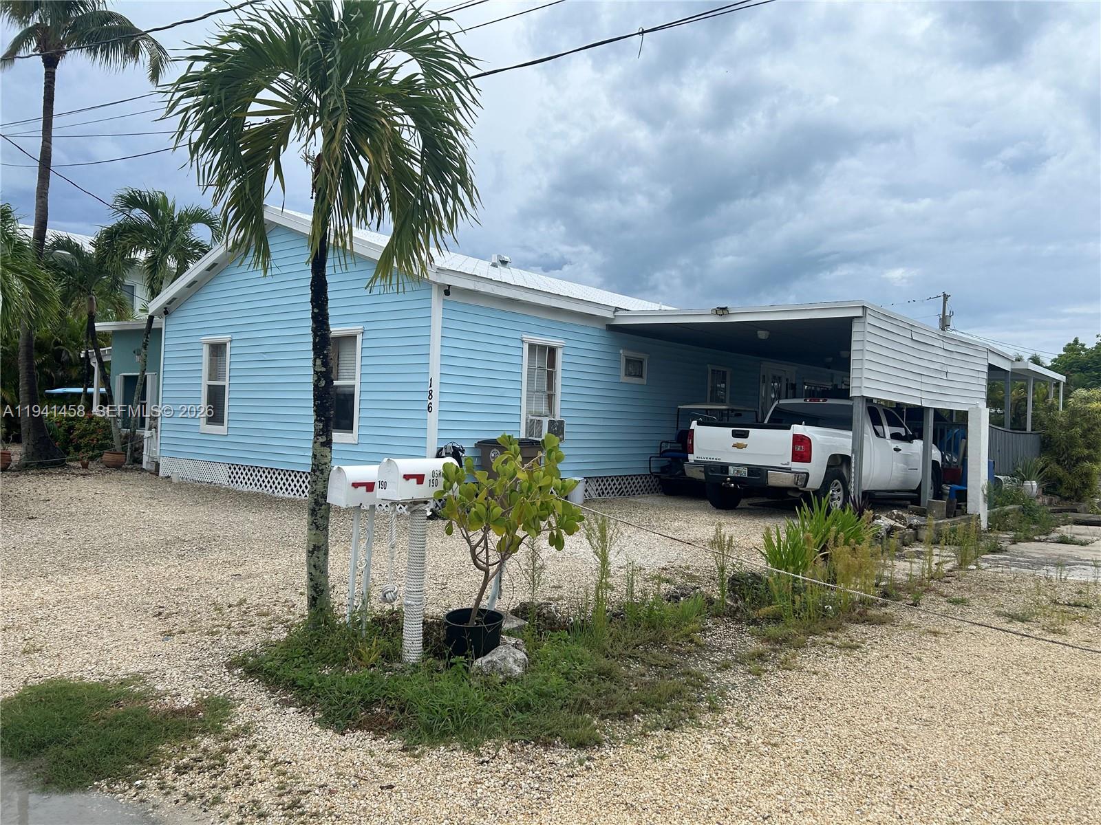 Canal-front mobile home within beautiful Key Largo with direct Intracoastal access. Enjoy tranquil water views from the spacious deck overlooking the canal, where manatees and dolphins are frequent visitors and fishing is right at your doorstep. The 45-foot dock provides ample space for boating and water activities. This charming home features a remodeled kitchen, roof 2021, beach access, boat ramp and breathtaking sunset views. Home is a 3/2 with 2/1 in main living area & a 1/1 in law quarter. This home offers the best of Florida Keys living in a serene tropical setting. ROGO exemption on file. Many multimillion-dollar homes being built in area.