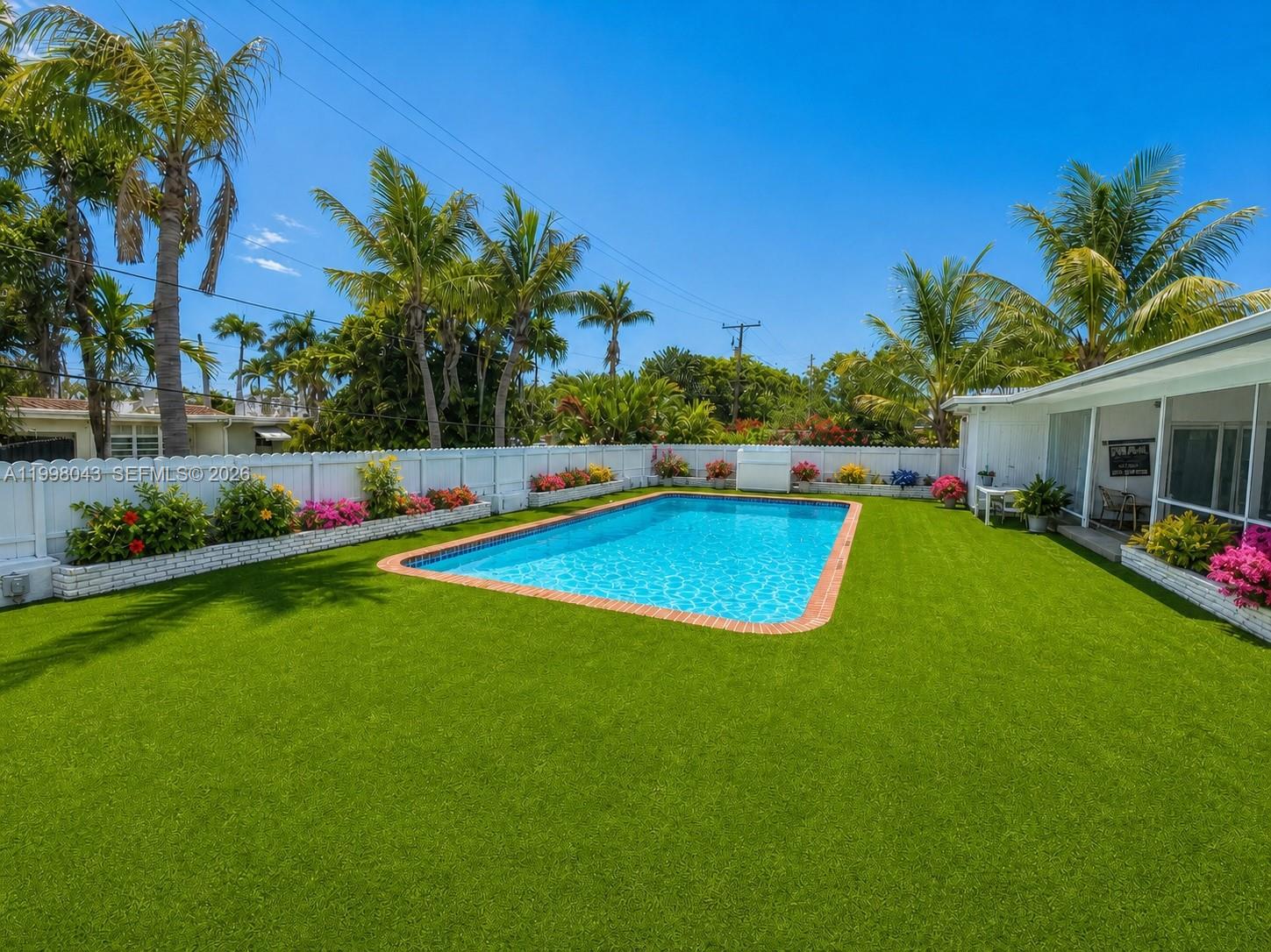 Stunning 2 Stories  Spanish-style home offering 5 bedrooms and 4 full bathrooms across approximately 3,610 sq ft of bright living space.
Wrapped in windows, the home is filled with beautiful natural light throughout the day.
The spacious outdoor area is designed for entertaining and relaxing, featuring a covered patio, pool, jacuzzi, and outdoor shower.
Ideally located near the golf course and just moments from the lake, this home offers the perfect blend of charm, comfort, and South Florida living.
