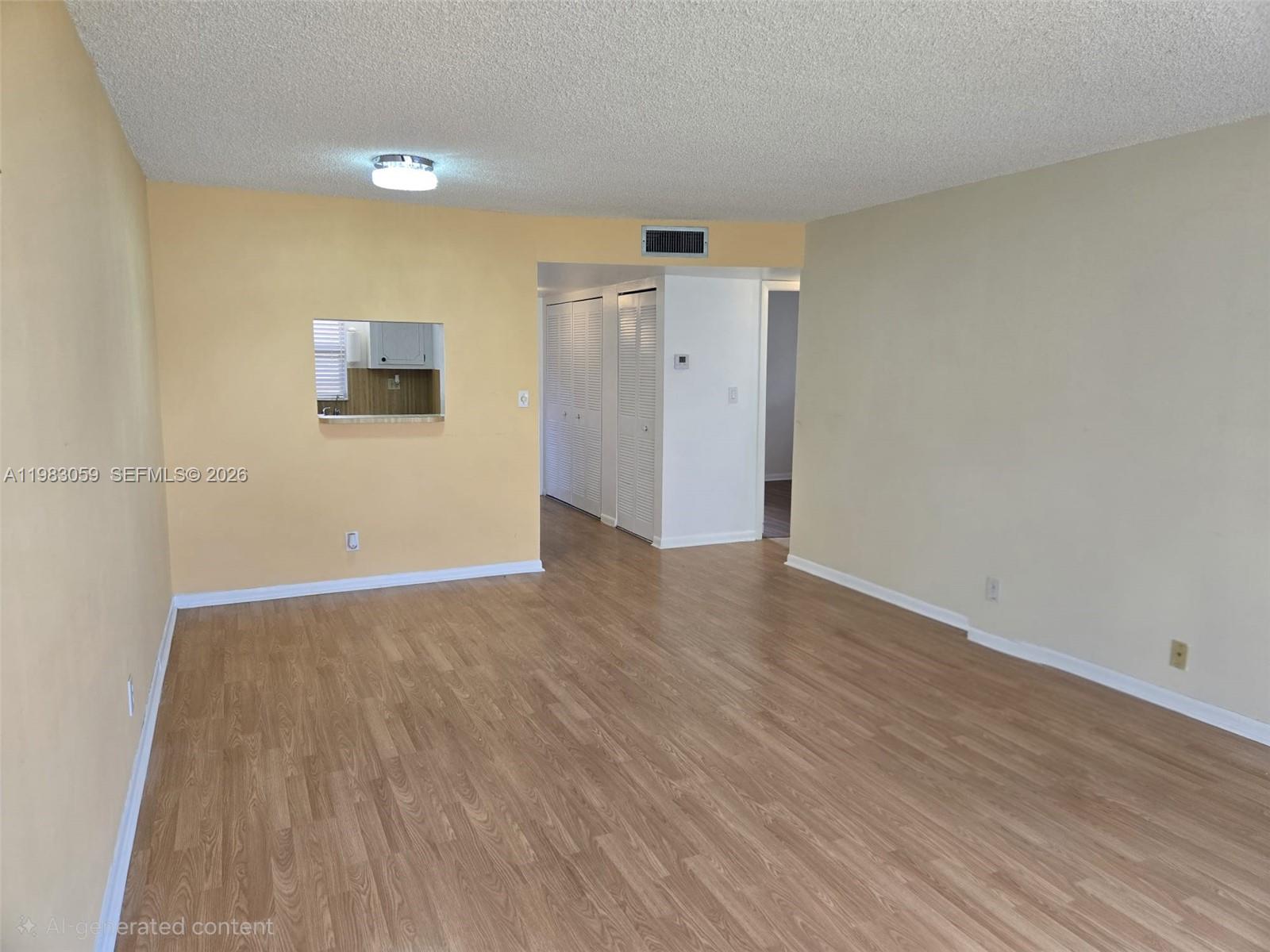 Welcome to South Florida living in the desirable 55+ community of Sunrise Lakes! This bright corner unit on the 2nd floor offers beautiful water and golf course views through impact windows, filling the home with natural light. Move-in ready and well maintained, it features laminate and tile flooring and a functional kitchen with stainless steel refrigerator and stove. Enjoy peaceful mornings overlooking the water and the convenience of being close to a heated pool open year-round. Sunrise Lakes offers resort-style amenities including a clubhouse with shows, concerts and dances, fitness center, billiards, three pools, jacuzzi, sauna, tennis, racquetball, shuffleboard, movie theater, and BBQ areas. Enjoy the active lifestyle and amenities this community offers year-round.