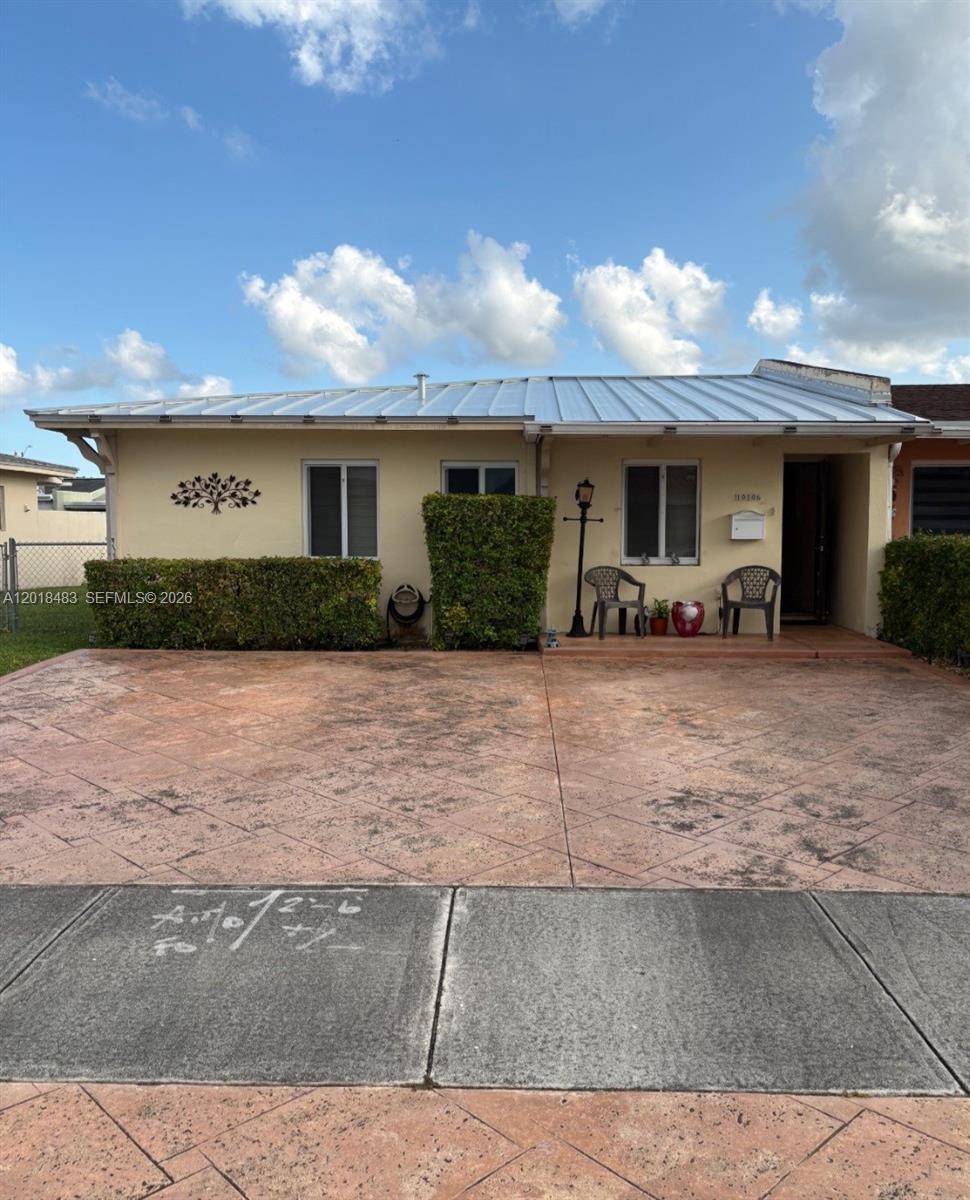 Excellent opportunity to buy at a reasonable price. Corner twin home in very good condition. Impact windows, updated appliances, including washer & dryer, Kitchen wood cabinets, with granite countertop, tiled floors. 4-year quality metal roof. Westchester neighborhood centrally located. Quiet yet close to major highways, main streets, shopping, schools and university.
