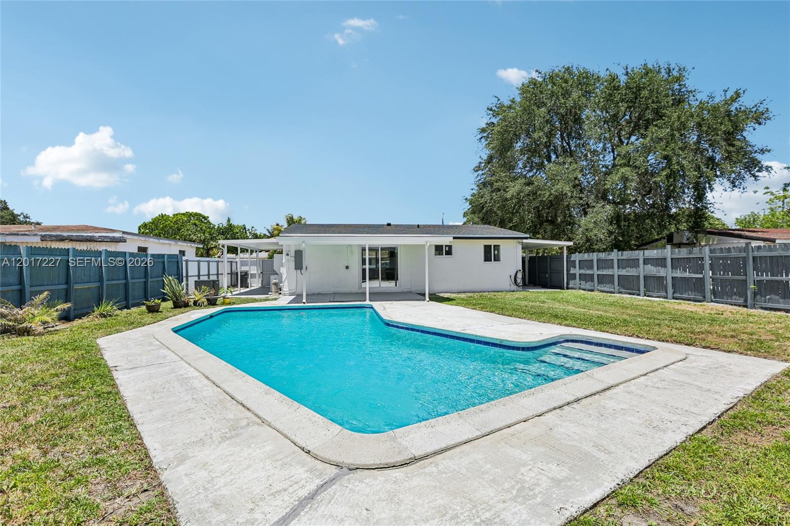 This fully reimagined residence blends modern luxury, comfort, and the ultimate South Florida lifestyle. Thoughtfully renovated from top to bottom, every detail has been carefully curated to create a true move-in-ready experience. From the moment you arrive, the home impresses with refreshed curb appeal, a brand-new roof, brand-new impact windows, new LED lighting throughout, and a spacious driveway with ample parking. Inside, natural light fills the open-concept living spaces, highlighting elegant flooring, clean architectural lines, and a seamless layout designed for everyday living and entertaining.

The brand-new kitchen serves as the heart of the home, featuring sleek custom cabinetry, granite countertops and backsplash, premium Samsung stainless steel appliances, and a modern extractor hood. Both bathrooms have been beautifully renovated with spa-inspired finishes, while upgrades including a brand-new air conditioning system, new PVC plumbing, and a brand-new electrical panel provide peace of mind for years to come.

Ideal for first-time homebuyers, this versatile property offers the potential to function as a 2/1 plus a separate 1/1 setup, creating income potential to help offset the mortgage. Actual square footage is larger than currently reflected in public records.

Step outside into your private backyard oasis featuring a renovated pool, covered terrace, expansive patio area, and fully fenced yard. Seller is offering $10,000 toward buyer closing costs.
