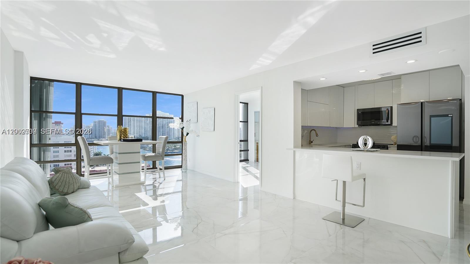 Glamorous coastal condo featuring: OCEAN & INTRACOASTAL VIEWS AND DIRECT BEACH ACCESS! Step inside this FULLY RENOVATED, two bedroom/two bathroom modern waterfront home.
Located in Hallandale Beach, Avant Garde is a boutique building set on the intracoastal waterway steps from the beach and offers resort style amenities. This cute, coastal condo features a bright, open layout with floor-to-ceiling windows and spa-like water views. Massive master bedroom with HUGE custom-built walk-in closet, custom cabinetry and private balcony! Stunning 36” Italian tile flooring throughout, new closet doors and abundant storage. Chef’s kitchen offers European-style cabinetry, quartz countertops & full backsplash, under-cabinet multi-color LED lighting, and high-end smart Samsung appliances, including touchscreen refrigerator with app-controlled features! Spa-inspired bathrooms include soaking tub, multi-jetted rain shower, illuminated vanities, and modern fixtures. Furnished with upscale modern furniture and designer accents throughout. 

Avant Garde's resort-style amenities include 24-hour security, heated swimming pool, tennis courts, fitness center, billiard room, concierge and fully appointed lobby. The great news is that the building has completed 40 AND 50-year certification, freshly painted and has NO special assessments.  Offering exceptional value for luxury coastal living. Ready to move in, just bring your toothbrush!