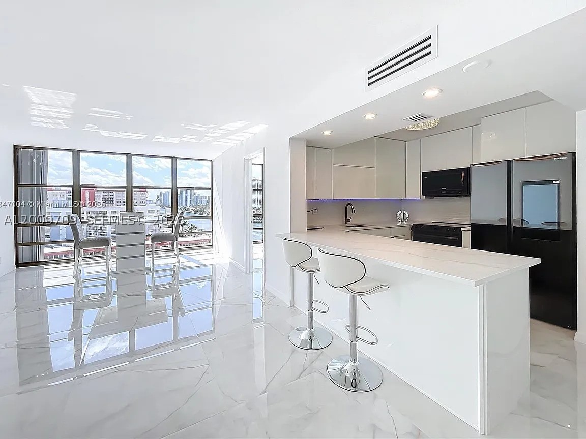 Turn-key, coastal residence with direct beach access and resort amenities. Monthly HOA is only $552/month! Building allows short term rentals and offers strong income potential! Step inside this beautifully renovated home with ocean and intracoastal views from every room! Avant Garde is a boutique building that is gated, set on the intracoastal waterway steps from the beach! 

This cozy, waterfront home features a bright, open layout with floor-to-ceiling windows and spa-like water views. Massive master bedroom with HUGE custom-built walk-in closet, custom cabinetry and private balcony! Stunning 36” Italian tile flooring throughout, new closet doors and abundant storage. Chef’s kitchen offers European-style cabinetry, quartz countertops & full backsplash, under-cabinet multi-color LED lighting, and high-end smart Samsung appliances, including touchscreen refrigerator with app-controlled features! Spa-inspired bathrooms include soaking tub, multi-jetted rain shower, illuminated vanities, and modern fixtures. Furnished with upscale modern furniture and designer accents throughout. 

Avant Garde's resort-style amenities include 24-hour security, heated swimming pool, tennis courts, fitness center, billiard room, concierge and fully appointed lobby. The great news is that the building has completed 40 AND 50-year certification, freshly painted and has NO special assessments! Offering exceptional value for luxury coastal living. Ready to move in, just bring your toothbrush!