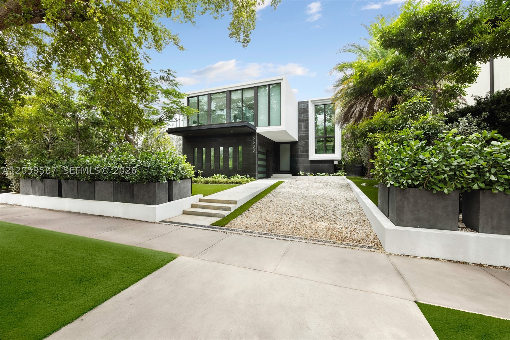5630 Pine Tree Drive is an exquisite 2022-built residence offering 4,062 square feet of thoughtfully designed living space, blending contemporary luxury with a tropical retreat in one of Miami Beach's most prestigious neighborhoods. A short distance to beaches, world-class dining, and elite shopping. This resort style 5 beds, 5.5 baths residence offers a private pool, heated spa, and rooftop terrace. Spacious open layout with dramatic 10–22 ft ceilings, sleek Italian flooring, linear air diffusers, and impact-rated glass windows and doors. Gourmet Italkraft kitchen features Cristallo Quartzite countertops, Sub-Zero appliances, and premium gas cooktop. Outdoor kitchen has gas BBQ, shower, and lush landscaping. Floating oak staircase leads to expansive bedrooms with en-suite baths. This home features custom vanities and premium Hansgrohe-Axor fixtures. A sophisticated sanctuary in the heart of Miami Beach.