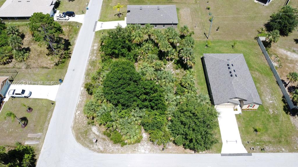 Discover a rare opportunity to own a 0.29 acre corner lot in Palm Bay Florida, perfect for residential development. This spacious and well positioned vacant residential lot is located in a peaceful neighborhood, offering easy access to mayor roads, schools, shopping and local amenities. As a corner lot, it provides added flexibility for custom home designs, multiple driveways options, and added curb appeal. With Palm Bay real estate rapidly growing, this lot is ideal for homebuyers, builders or investors looking to capitalized on Florida's booming housing market. No HOA fees. This is a high demand area with strong investment potential. Don't miss out-secure this corner lot today.