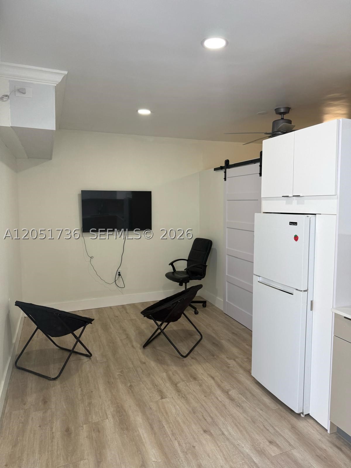 Brand new, completely remodeled back apartment featuring a private side entrance. This unique studio layout offers a separate bedroom area and one bathroom. Utilities (water and electricity) are included!