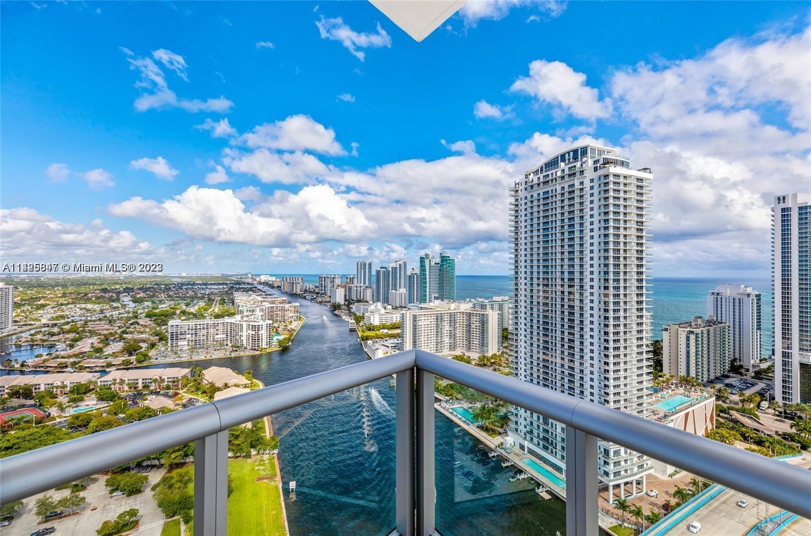 PENTHOUSE UNIT - AIRBNB & SHORT TERM RENTAL FRIENDLY! Situated in the highly desirable Hallandale Beach, this property enjoys close proximity to pristine beaches, dining, shopping centers, entertainment, and everything you need for a fulfilling lifestyle. Perched on the 33rd floor, this residence boasts mesmerizing panoramic views of the ocean, Intracoastal, and city skyline with 319 sq ft of balcony space. Spanning 1,577 sq ft, this unit offers a spacious and well-designed layout, providing ample space, featuring an open kitchen with top-of-the-line appliances, custom cabinetry, & a large center island. Residents have access to a wide range of world-class amenities, including two pools (one private rooftop), state-of-the-art fitness center, spa, concierge services, and much more.