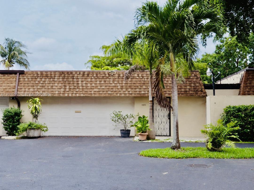 Tastefully Updated Villa in the Heart of the Country Club of Miami with Both Lakefront and Golf Course Views. Before entering the unit a large Courtyard awaits you Ready for your Taste in flowers, plants, orchids... Once you are in the unit, you'll be greeted with beautiful white porcelain tiles, expansive Living, Dining and Family Room Areas and awesome views. Updated Features include: Wood Cabinets, Granite Countertops, Decorative Backsplash, Stainless Steel Appliances and a Laundry area adjacent to the kitchen. The Dining Area has a built ideal for Cutlery and Fine China and decorative wall shelving which add a modern decor, all 3 bathrooms have been exquisitely remodeled.  Wait there is more, relax and enjoy the open patio overlooking serene and peaceful views of a lake and a public golf course with a clubhouse and restaurant. You can also enjoy Miami Dade County Public Pool, Gym, Tot-Lot Plus More... This home lends itself for entertaining and is truly what South Florida Living is all about. In close proximity to I-75, Broward County, Turnpike and 826. Great Schools too!