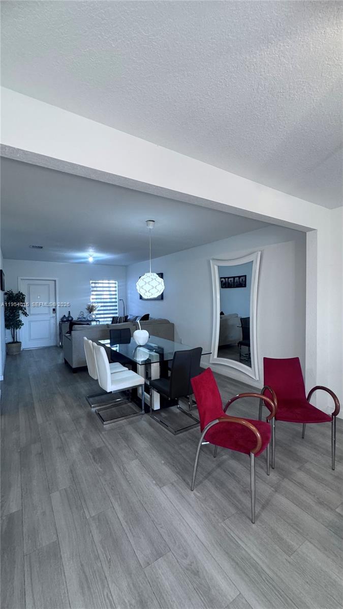 Beautiful Corner 2-story townhome built in 2022 featuring 4 bedrooms / 3 baths, 1 bed and full bath in ground floor. Nice fenced patio with BBQ, Sink, and Stove ideal to enjoy cooking outhome, Retractable Patio Awning,  2 assigned parking spaces just front of home,  Located in the desirable Keys Pointe community with resort-style amenities clubhouse, Olympic-size pool, gym, basketball & playground. Low HOA ($150/mo). Property features solar panels are financed and transferable. Close to the Florida Keys and major highways.Excellent income potential and location! Lease Ok! Seller Motivated...