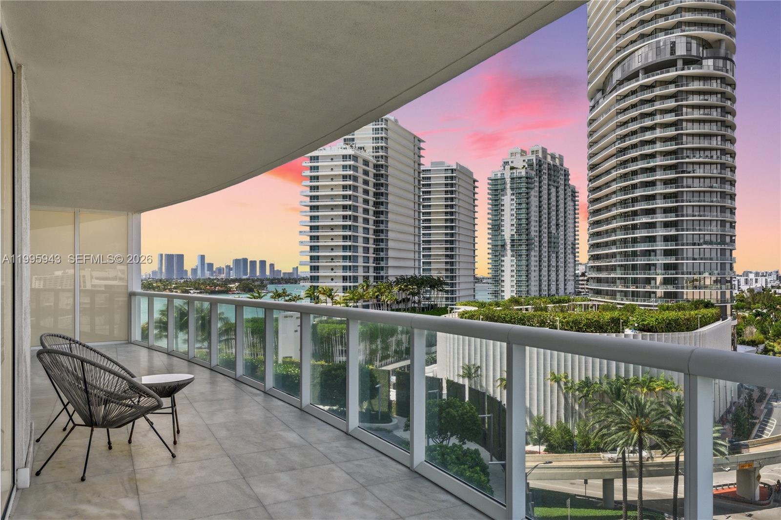 Experience elevated living at ICON South Beach in this 2BR/2BA CORNER residence showcasing sweeping views of Miami Beach, the South Pointe skyline, ocean, bay, and marina from the expansive ~800 SF wraparound terrace. An extension of the interior, the eight foot deep balcony is ideal for entertaining and indoor-outdoor living, providing both sunrise and sunset exposures. Inside, the split floor plan offers nearly 1,400 SF of white interiors, marble tile flooring and an open kitchen with Miele appliances and induction cooktop. The primary suite captures panoramic sunrise ocean views and includes a spacious, spa-like bath with dual sinks and jacuzzi tub. Designed by Philippe Starck, ICON South Beach is a premier South of Fifth address known for its resort-style amenities, including a bayfront pool deck, two infinity-edge pools, a state-of-the-art fitness center, spa services, and a waterfront café overlooking the marina. Just moments from the beach, marina, and top SoFi dining, this iconic tower offers one of the most desirable lifestyles in Miami Beach. Come see it in person, the views are gorgeous.