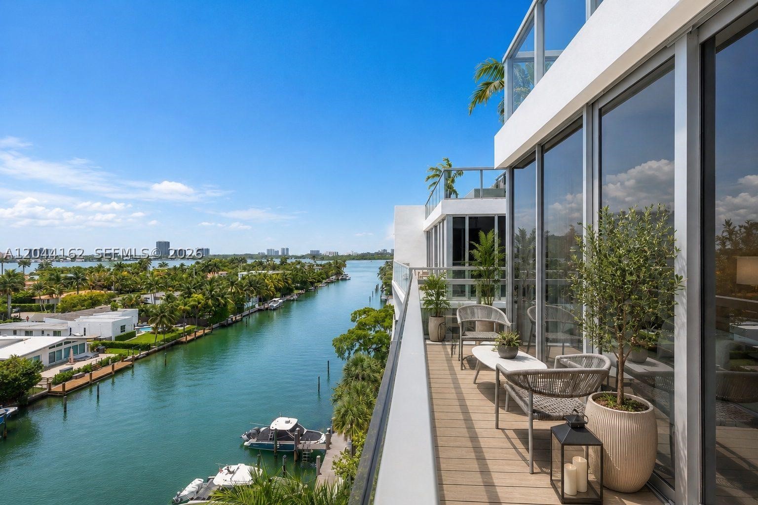 Live in one of Miami's most coveted boutique buildings in the heart of Bay Harbor Islands — one of South Florida's safest and most charming neighborhoods. This stunning 3-bed/3-bath penthouse corner unit offers 1,834 SF of turnkey luxury with breathtaking panoramic views of Biscayne Bay, the Intracoastal, and the Miami skyline from every angle. West-facing exposure delivers spectacular sunset views that never get old. Oversized corner layout floods every room with natural light. Beautifully furnished and move-in ready — just bring your toothbrush. Chef's kitchen with premium appliances, walk-in closets, wood floors throughout, and high-impact doors. Two assigned parking spaces. KAI offers resort-style amenities: heated pool, spa, rooftop BBQ terrace with bay views, fitness center, bike storage, business center, and 24/7 lobby security. Pet friendly. Steps to the beach, Bal Harbour Shops, and top-rated A+ Miami-Dade public schools. Easy access to Aventura, Sunny Isles, and Miami Beach. A rare opportunity to own a true penthouse in one of Bay Harbor's most exclusive boutique addresses. Furnished and move-in ready.