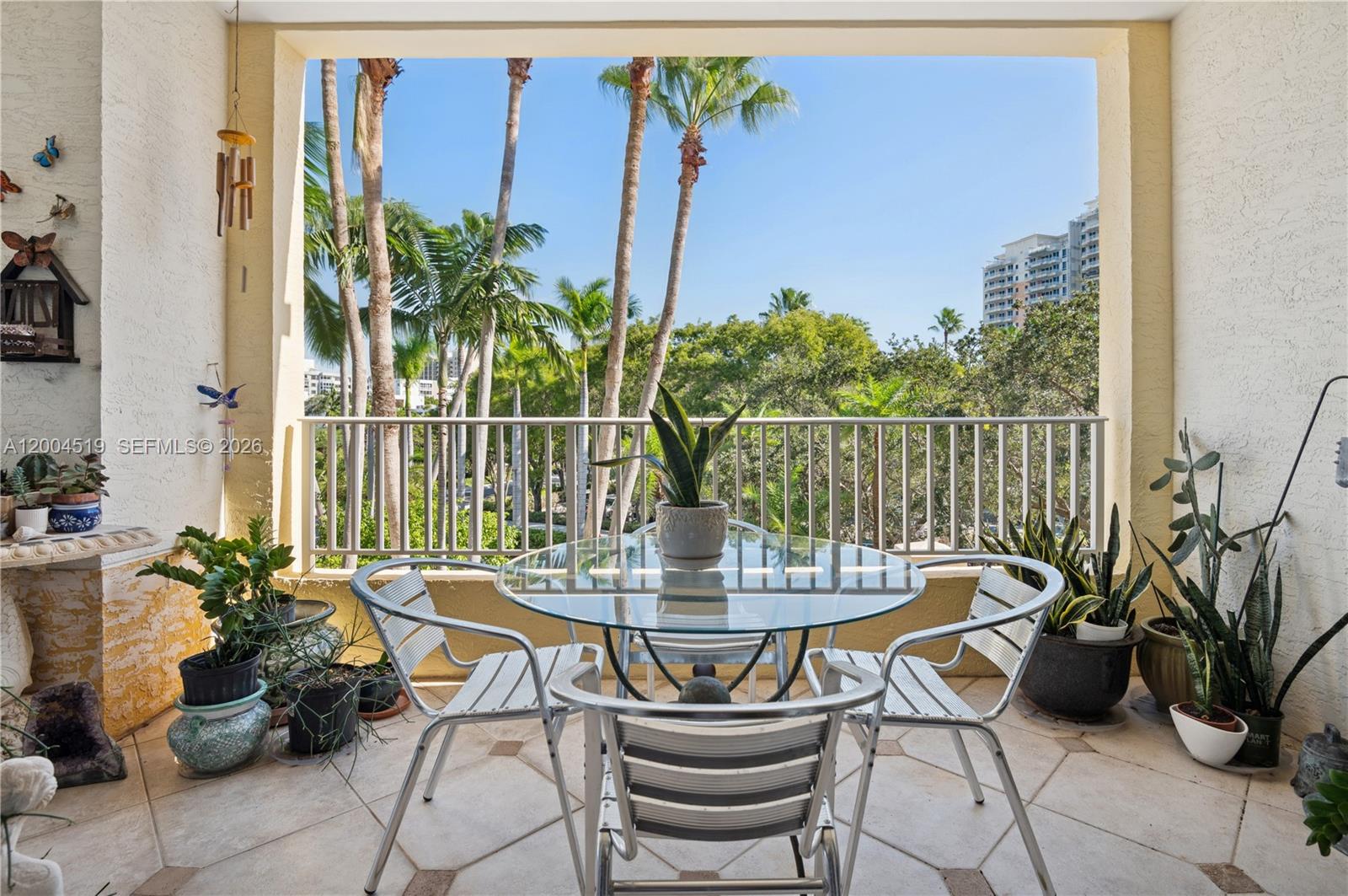 European charm meets coastal living at the Ocean Club in this delightful French-inspired 2BD/2BA pied-à-terre at Resort Villa II in Key Biscayne. This elegant flow-through condo features ceramic tile floors in the main living areas and cozy wood floors in the bedrooms, plus private elevator access that opens directly into a spacious living area with floor-to-ceiling sliding glass doors that lead to an expansive terrace and fill the home with natural light. The residence also offers three parking spaces, (2) in the garage and (1) outside.  Residents savor a true resort lifestyle with Ocean Club pool and beach service, multiple on-site restaurants, tennis courts, state-of-the-art gym, spa, kids’ play area, co-working offices, and more.