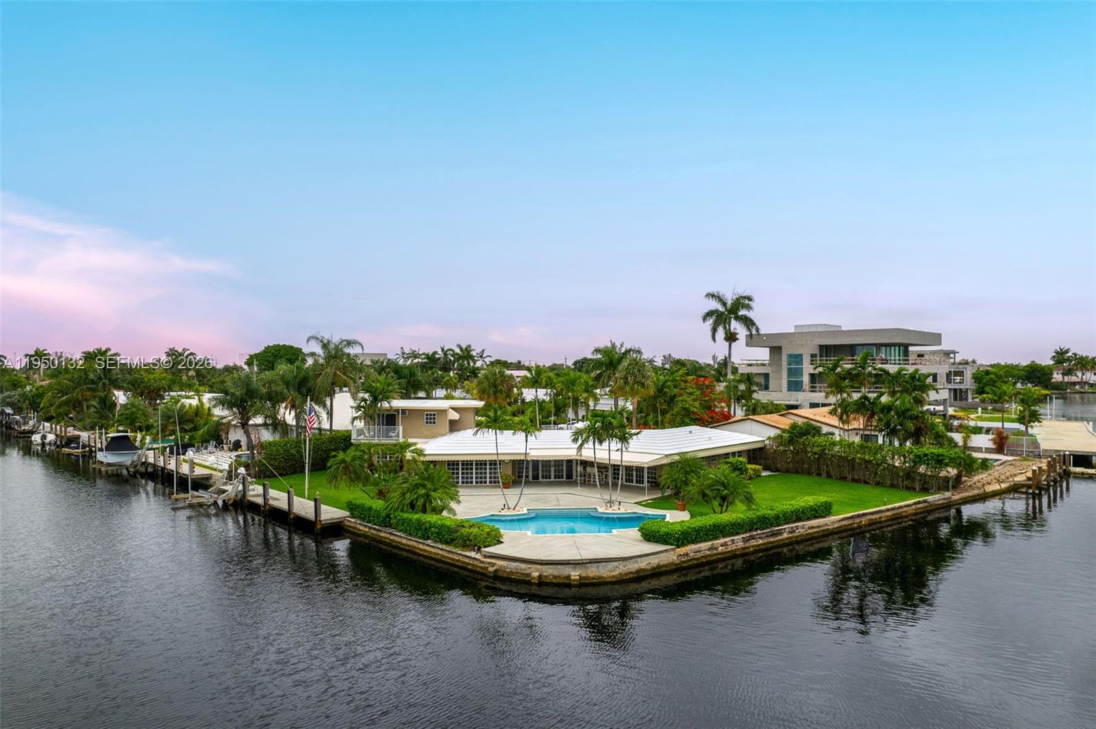 THE PROPERTY IS TENANT-OCCUPIED. KINDLY REFRAIN FROM DISTURBING TENANTS OR KNOCKING ON DOORS. Attention Boaters! Private & gated home nestled on a 11,982 SF corner point lot with 252 ft of deep water frontage, ocean access, & a boat dock. Enjoy a huge driveway with covered parking, sun-filled interiors, open eat-in kitchen, spacious bedrooms, upstairs balcony, & primary suite with roomy walk-in closet, & bathroom with dual sinks, jacuzzi tub, steam shower, & bidet. The serene backyard is ideal for entertaining with a generous patio, gorgeous heated pool, Al Fresco dining, & endless water views. Located in prestigious Lauder Gate Isles, close to beaches, great schools, Downtown Fort Lauderdale, shopping & top dining!