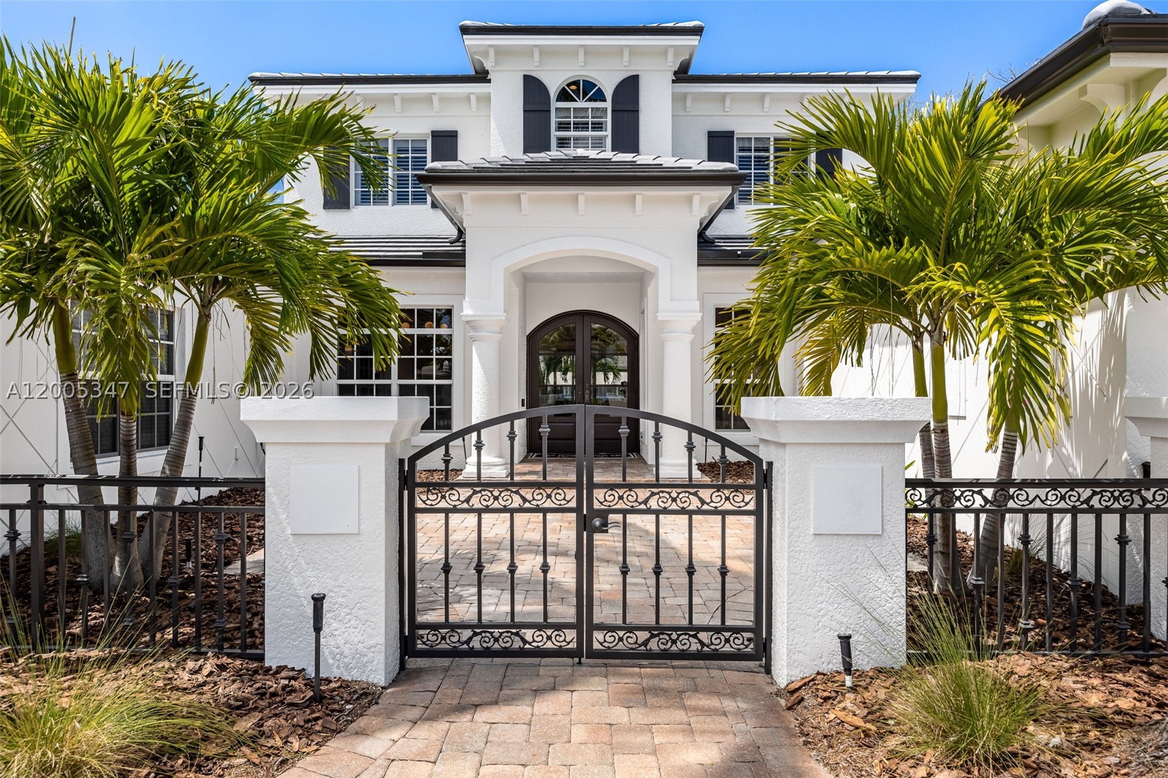 Welcome to luxury waterfront living in the highly desired McGregor Isles, one of Fort Myers’ premier boating communities with direct Gulf access. Set on a quiet cul-de-sac, this custom home offers breathtaking intersecting canal views, SW rear exposure, and stunning sunsets, complemented by seamless indoor-outdoor living. A lush tropical entry leads to a light-filled open floor plan with coffered ceilings, designer finishes, and panoramic water views throughout. The remodeled chef’s kitchen features quartz countertops, an oversized island, Wolf ovens & gas cooktop, and Miele dishwasher & a climate-controlled wine cellar. Expansive sliding glass doors open to a resort-style outdoor space with a panoramic screen, pool, fireplace, and generous entertaining areas. The first-floor primary suite offers serene water views, dual walk-in closets, and a spa-inspired bath, while the main level also includes formal living & dining areas, a home office, half bath, and laundry room. Upstairs features a flexible loft-style living area with screened balcony and three bedrooms, including a private en-suite and Jack-and-Jill layout. Upgrades include white oak flooring, impact windows and doors, a whole-home generator, and a 2025 roof on home & boathouse, 2026 hot water heater. An extended dock and covered boathouse accommodate up to a 36-foot boat with no bridges and quick Gulf access—just minutes from beaches, shopping, and dining, offering the ideal blend of luxury, location, and lifestyle.