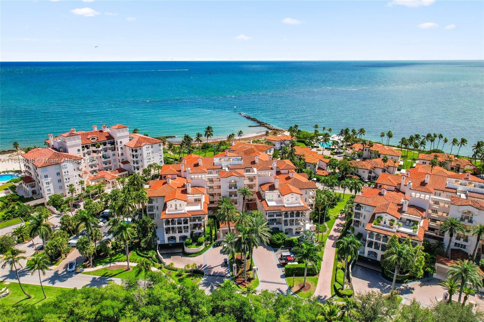 Exquisite ground-floor corner unit in Seaside Village featuring a contemporary, open, and bright floor plan. Exquisitely renovated and professionally decorated with top-of-the-line finishes. The expansive, oversized wraparound terrace offers gorgeous sunrise views and a seamless flow to the bedroom terraces, perfect for indoor/outdoor living. Just steps from the oceanfront pool and private beach. Enjoy world-class amenities including the Beach Club, Racquet Center, Spa, Restaurants, Marina, Vanderbilt Mansion, and residents-only beach. A fantastic investment opportunity, this unit allows daily rentals. Also available for lease.