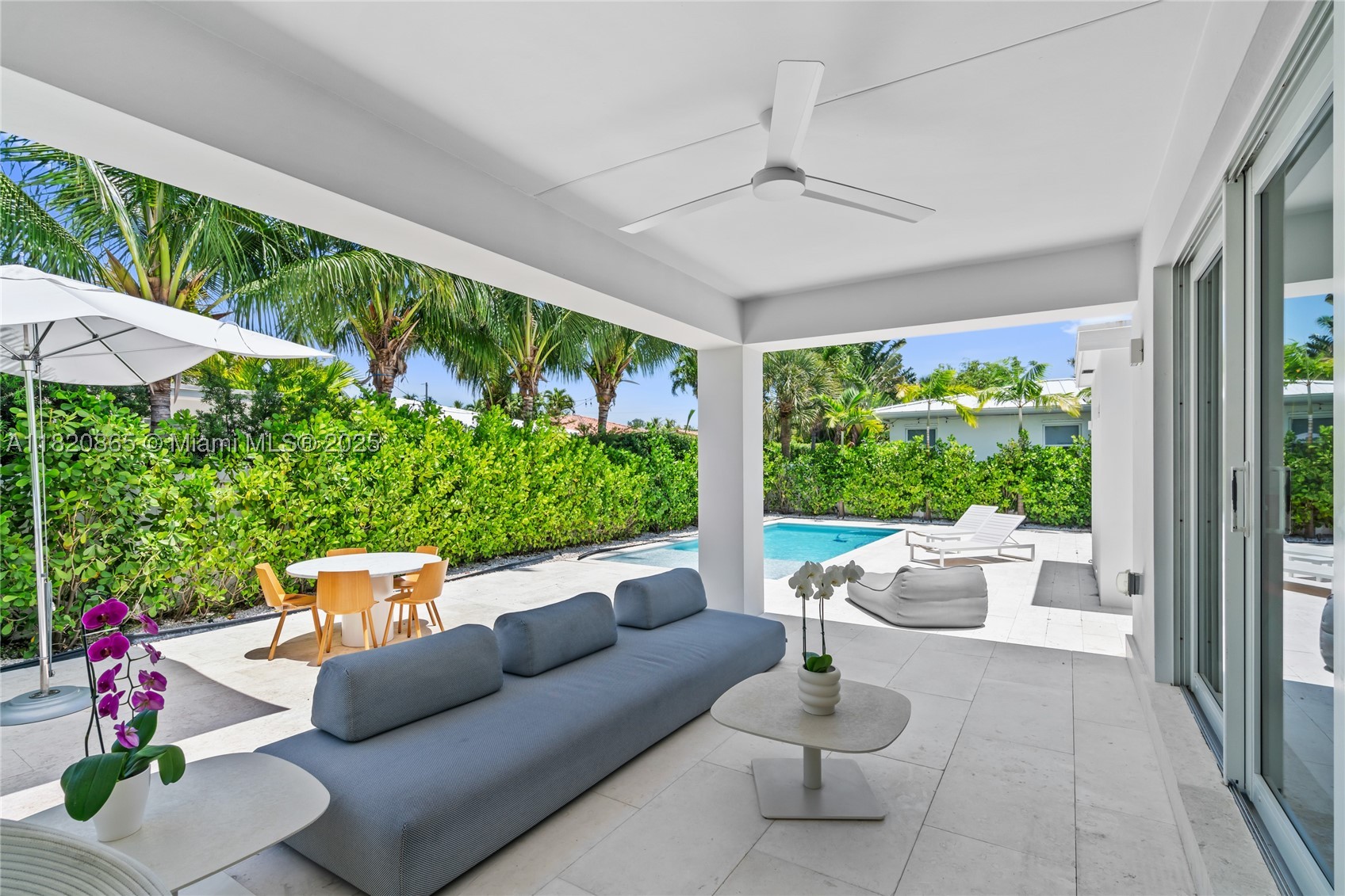 Step into this tastefully fully renovated 4 bedroom, 3.5 bathroom residence located on an oversized 8,400 sq ft lot in the desirable Surfside neighborhood. With 2,267 sq ft of interior space, this home offers a spacious and functional layout. Enjoy seamless indoor-outdoor living with a covered porch (159 sq ft), a summer kitchen ideal for entertaining and a large pool surrounded by landscaping. Features a new kitchen with top of the line appliances. The oversized lot not only offers privacy but also incredible potential for future expansion. Every detail has been thoughtfully designed & updated, offering both style and comfort in a prime location just minutes from the beach, shops, and top-rated schools.