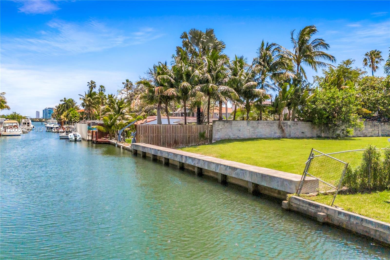 Spectacular 14,744 SF waterfront lot with no fixed bridge to the ocean. Ready to build your masterpiece with a new seawall already in place and concrete privacy walls on pilings. A rare opportunity to develop a substantial custom home in a sought-after neighborhood.