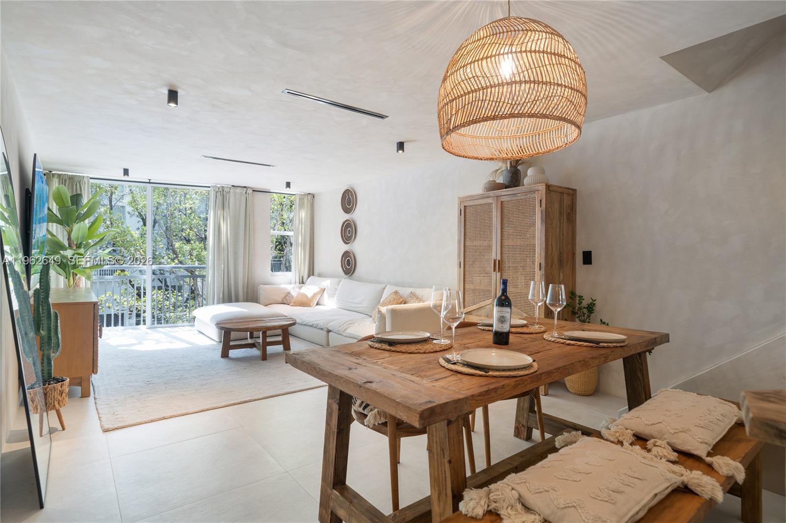 Discover a truly special 3-bedroom, 2-bathroom townhouse in the heart of Miami Beach, featuring a garage and a landscaped patio area, located in a prime South of Fifth location, one of the most iconic and well-positioned areas in the city.

This residence has been thoughtfully refreshed with a cohesive, modern aesthetic inspired by natural textures and relaxed coastal elegance. Lime-washed walls, soft neutral tones, and custom finishes create a warm, serene atmosphere throughout. The open living and dining areas flow seamlessly, offering an inviting space ideal for both everyday living and entertaining.

The kitchen has been tastefully updated with contemporary cabinetry, sleek countertops, and quality appliances, blending functionality with refined design. The bathrooms and storage spaces have also been carefully enhanced to maximize comfort and usability, while large-format tile flooring runs throughout for a clean, timeless look.

Sold fully furnished and fully equipped, this home is truly turn-key — just bring your clothes and start enjoying Miami Beach living from day one. Every piece has been intentionally selected to complement the space, creating a cohesive, boutique-style feel.

Situated just moments from the beach, top restaurants, parks, and the marina, this townhouse offers the perfect balance of tranquility and Miami Beach lifestyle.

A rare opportunity to own a move-in-ready residence in a prime South of Fifth location.