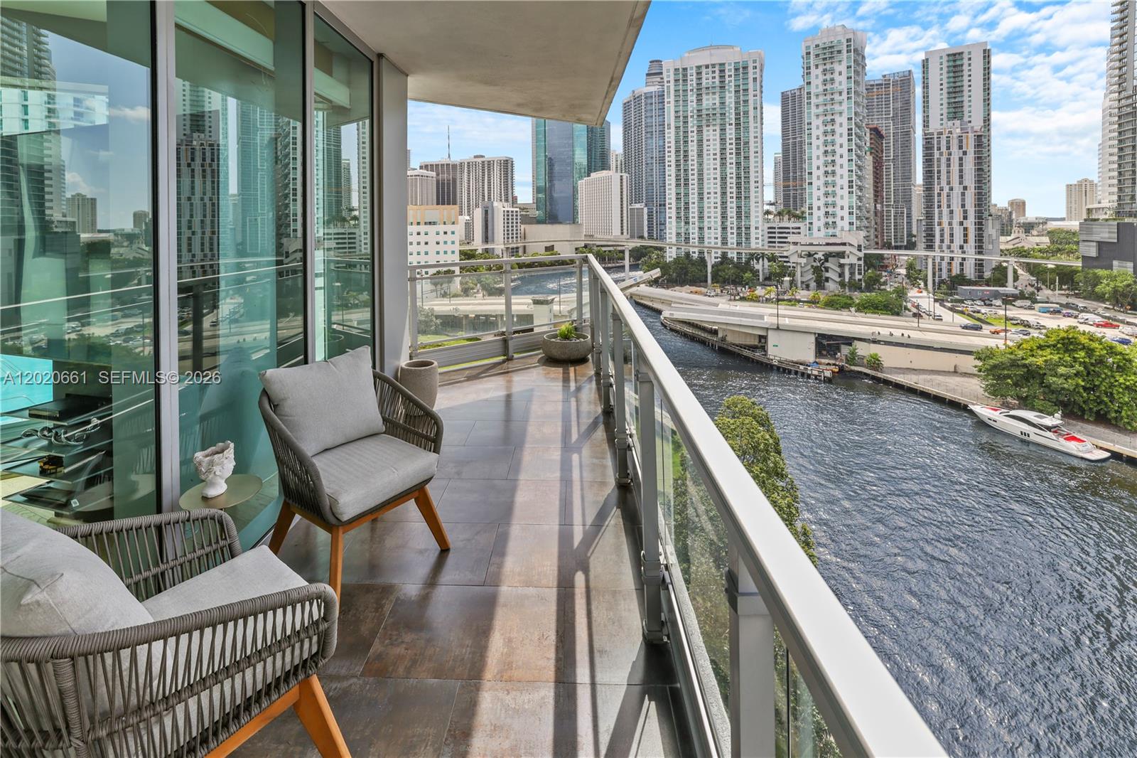 Residence 1201 at Mint Condominium offers a rare opportunity to live in Brickell’s only gated riverfront community. This sun-filled 3-bedroom, 3-bath residence spans 1,544 square feet and showcases panoramic views of the Miami River and city skyline from two oversized private balconies. The interior has been recently refreshed and features wood flooring throughout, custom built-in closets, and motorized blackout window treatments, creating a comfortable and refined living environment. High-speed internet service and one assigned parking space. Mint Condominium provides an extensive collection of resort-style amenities, including a heated lap pool, jacuzzi, sauna, steam room, full-service fitness center, yoga studio, co-ed spa, and a children’s playroom. Conveniently positioned with direct access to I-95, the location allows for effortless commuting while remaining moments from Brickell’s dining, shopping, and entertainment destinations.