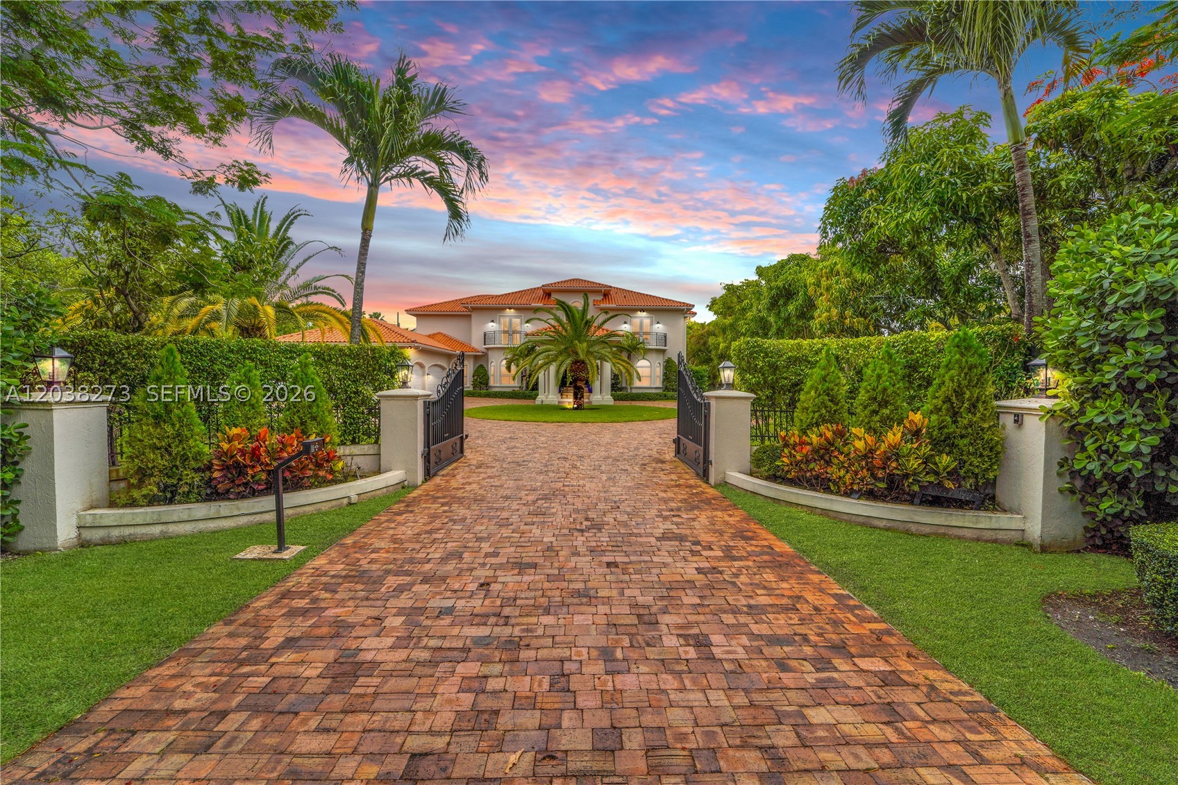 Situated on a spectacular 1.25-acre corner estate in the heart of Pinecrest, this fully renovated 7-bedroom, 6.5-bath residence offers approximately 6,714 sq. ft. of thoughtfully designed living space, blending sophistication, comfort, and resort-style living. Complete with a 3-car garage, the home features elegant marble floors, high-end finishes, and modern upgrades throughout. Designed for everyday living and grand-scale entertaining, the chef’s kitchen showcases premium Sub-Zero refrigeration, including an additional unit in the laundry room, a professional-grade Viking range, and two expansive islands. The luxurious primary suite serves as a private retreat with three custom closets and an adjoining den ideal as a sitting room, nursery, office, or potential eighth bedroom. The spa-inspired bath features an enclosed soaking tub and dual rain shower sanctuary. Outside, mature tropical landscaping surrounds a sparkling pool, elegant gazebo, basketball court, and an impressive collection of fruit trees, including more than 15 mango trees and several avocado trees. Set on a sprawling 54,450-square-foot lot, this move-in-ready estate offers exceptional privacy, space, and amenities, embodying the very best of Pinecrest luxury living. A rare opportunity where thoughtful design, modern luxury, and resort-inspired outdoor living come together in one exceptional offering.