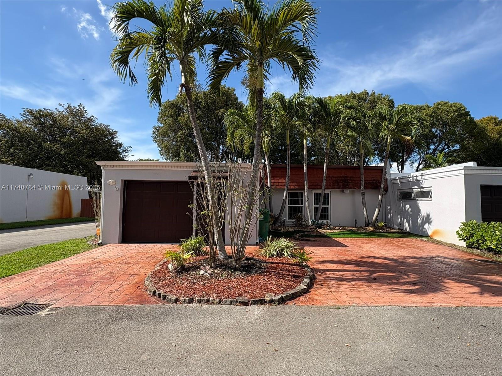 Spacious Townhome in Country Club of Miami. Corner Unit with 1 Car Garage. Tile flooring throughout. Large Kitchen and updated bathroom. Low Association Fee. Just call Listing Agent.