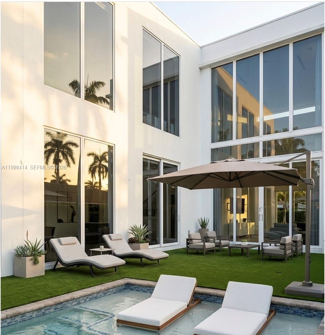 JUST REPOSITIONED – BEST VALUE IN HOLLYWOOD LAKES

Modern luxury home built entirely with full concrete construction, including roof and intermediate slab, offering exceptional durability and storm resistance. Located just a short walk to the beach with access to boating, this property delivers a rare combination of lifestyle and structural quality.

Spacious open layout with abundant natural light, high-end finishes, and seamless indoor-outdoor living. Heated pool and spa, generous entertaining areas, and a natural gas generator providing full-home backup power.

A unique opportunity to own one of the few modern concrete homes in the area, now aggressively priced to reflect current market conditions.
Please text listing agent and submit proof of funds prior to scheduling a showing.