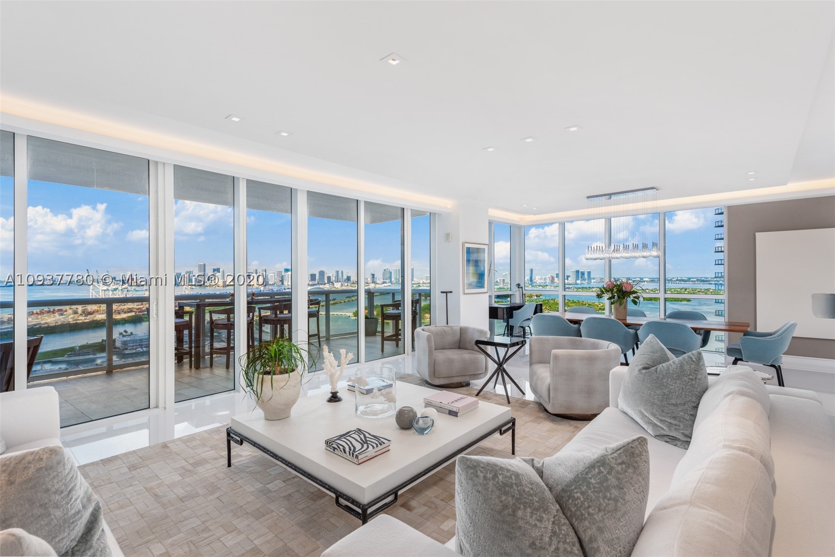 Enter this flow thru unit via an oversized pivoting door from your own private elevator lobby. This exquisite property features panoramic sunrises and sunsets from the 3 terraces. Elegant lines and floor to ceiling windows that open seamlessly to the expansive views capturing downtown, ocean and the bay. Totally renovated smart home with open layout, 3 Bed, 3.5 Baths, media room, temperature controlled glass wine room, white porcelain floors, electric shades, remodeled kitchen, custom cabinetry and designer finishes throughout. Murano Grande is a 1st class luxury building with a pool side restaurant (delivery to residence), tennis, gym, 24 hour security, valet and concierge. Located on Miami Beach Marina in the premier Sofi neighborhood with restaurants, beach, parks and shopping close by.