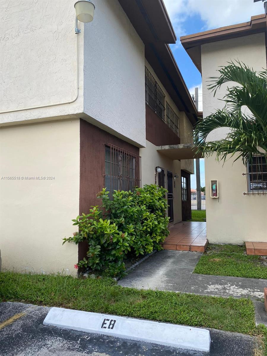Renovated and Remodeled Charming modern two-story corner townhouse in a gated community, ideal for a family looking for a dream home or an investor seeking a prime opportunity. This home offers 4 bedrooms, 2 stylishly updated bathrooms with glass shower doors, spacious closets, and a bright, open floor plan with porcelain floors. Enjoy the convenience of in-unit laundry and assigned parking in front of your front door, all within walking distance to shopping, FIU, and nearby malls. Community amenities include a clubhouse, pool, and sports courts. Don’t miss out on this fully remodeled gem.