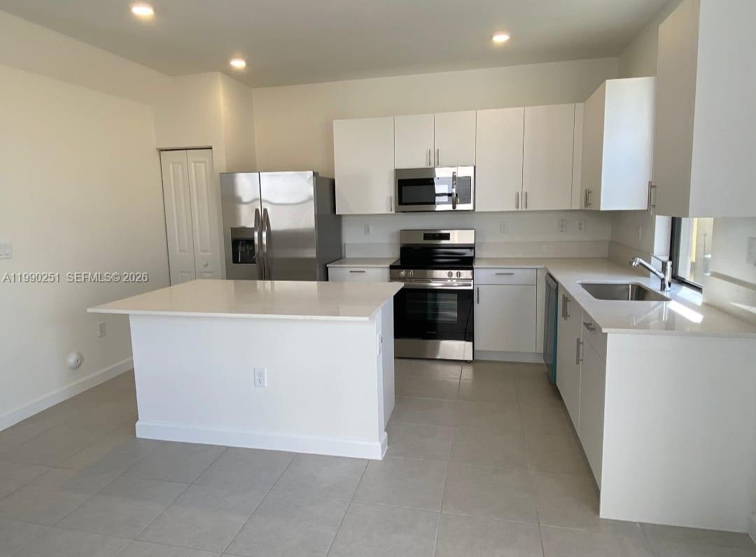 Added efficiency and income potential define this beautiful 2023-built property with modern finishes and quality construction. The main home offers 3 bedrooms and 2 bathrooms, plus a converted 2-car garage now functioning as a fully equipped 2 bed / 1 bath apartment with its own kitchen. Ideal as a 5 bed / 3 bath residence or as an income-producing duplex.

Perfect for large families or buyers looking to offset their mortgage with rental income. Conveniently located just one turn off US-1, providing easy access for commuting—approximately 45 minutes to Downtown Miami, 50 minutes to South Beach, and 30 minutes to the airport.

A rare opportunity combining flexibility, location, and income potential.