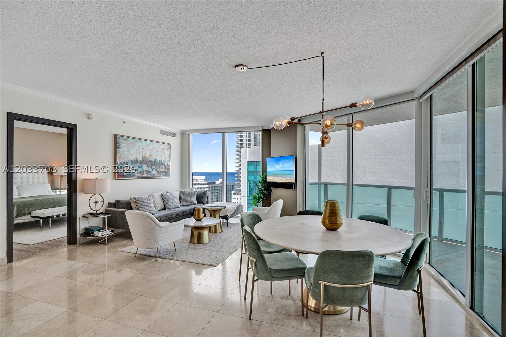Experience elevated coastal living in the heart of Sunny Isles Beach. This beautifully furnished 3-bedroom, 2-bathroom residence offers a sophisticated open-concept layout, designer finishes, and abundant natural light throughout.
The modern gourmet kitchen features premium stainless-steel appliances, sleek cabinetry, and ample space for entertaining. The spacious bedrooms provide comfort and privacy, while the spa-inspired bathrooms create a true retreat experience.

Step onto your private balcony and enjoy breathtaking views, perfect for relaxing mornings or sunset evenings. Residents enjoy access to resort-style amenities, including a sparkling pool, state-of-the-art fitness center, concierge services, and more.
Ideally located just steps from the beach, world-class dining, luxury shopping, and premier entertainment, this property presents an exceptional opportunity as a primary residence, vacation home, or income-producing investment.
Offered fully furnished and move-in ready. Private video tour available upon request. Contact us today to schedule your exclusive showing.