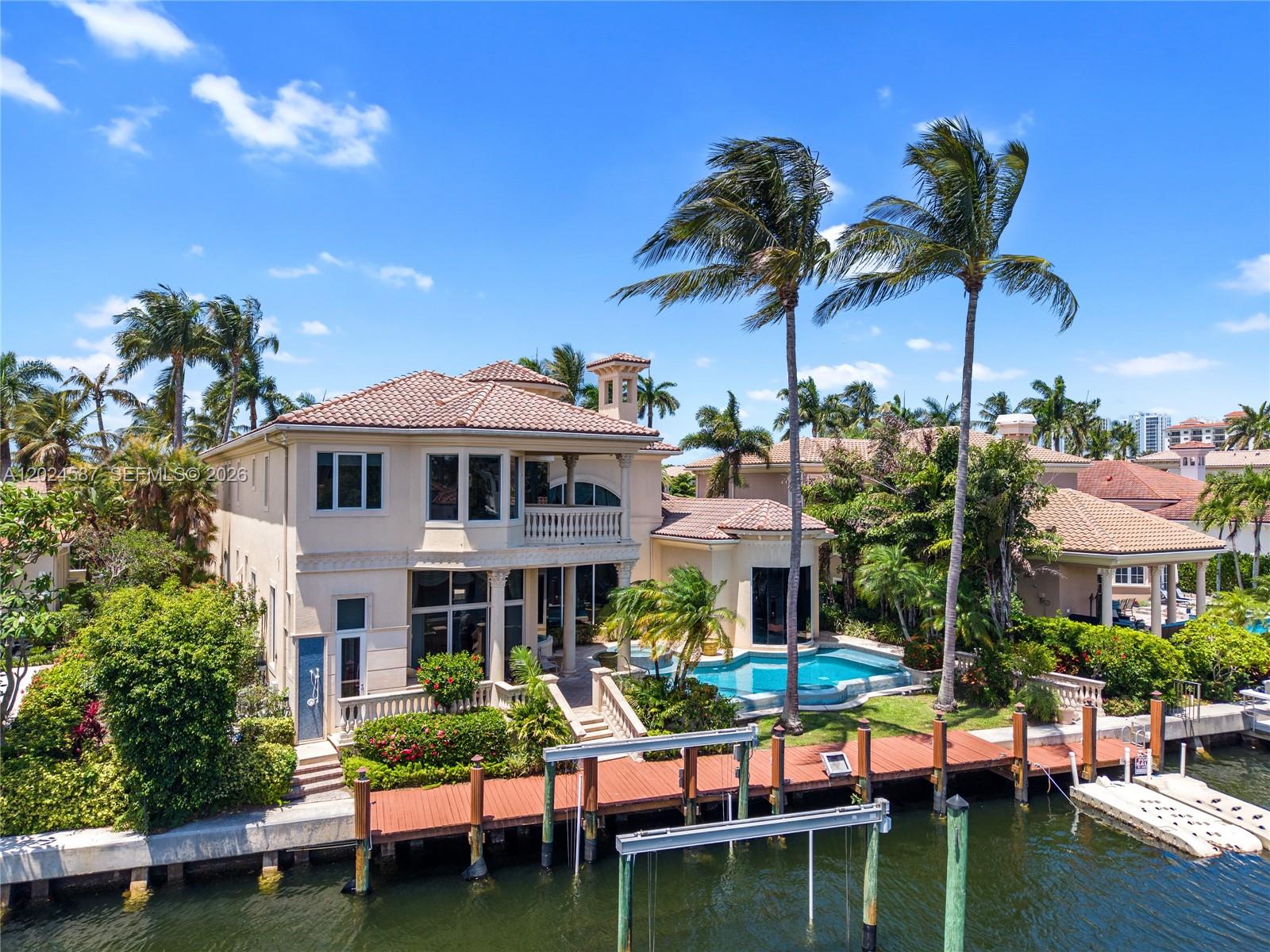 Waterfront Estate w/deep water dockage & ocean access w/no fixed bridges.Has 90 ft. dock that can fit up to a 70 ft. boat.Currently is a lift with up to 24,000 pds.Located in the finest gated community of Harbour Isles.This 5 bed 5 baths w/2 half baths + den/library, and 3 car garage has no details sparred.30 foot ceilings +-, with a very spacious  open floor plan.Private elevator,large formal dining room,bar,fireplace,spacious family room off the open kitchen.Primary en suite bedroom is generous size.From the bedroom,you have direct water views.4 walk in closets. Beautiful primary bathroom suite with/ double sided sinks,double sided walk in shower w/ jacuzzi bath facing an outside waterfall and an interior high tower with natural windows for lighting.Chef's gourmet kitchen w/Viking Professional gas stove,Subzero,Miele appliances.Marble open countertops bar style for eat in kitchen w/ island.Large wine cooler and butlers pantry.Private elevator takes you to the 2nd floor or take the stunning marble staircase and enjoy the front facing terrace on the way up or continue to the 2nd floor landing.2nd floor has a 3/3 en suite including another primary bedroom on this floor with stunning water views of the intracoastal and pool area. Washer/dryer, wet bar and family room on this level, 1 balcony and terrace.The Villa features custom millwork, coffer and tray ceilings w/ multi level moldings,double door entry ways. Entertainer's delight backyard on the water.Pool,whirlpool-barbecue.
