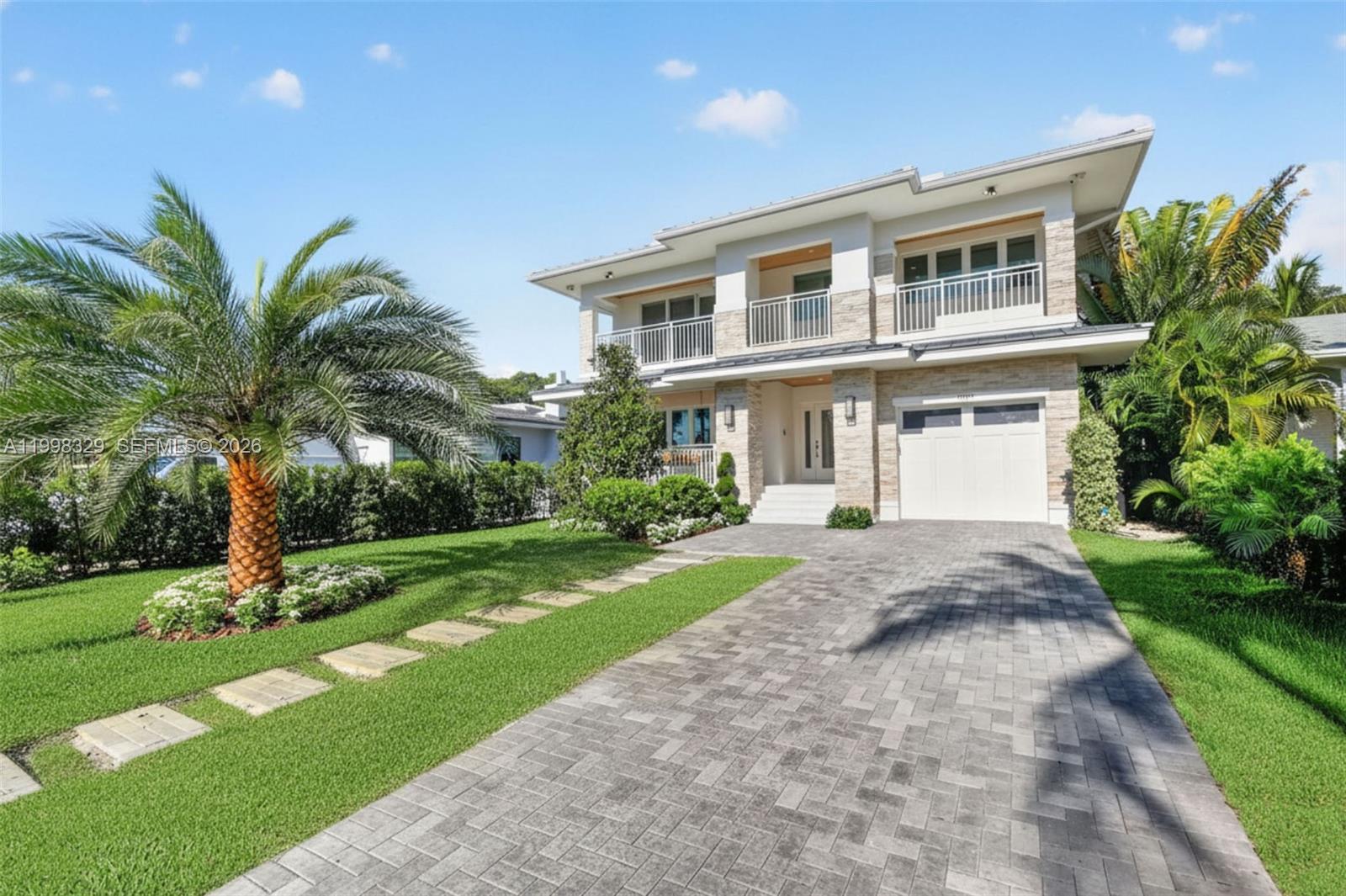Magnificent newly constructed 5BR/5BA smart home in the heart of Lake Worth Beach- this home offers the ideal blend of luxury, technology, and coastal charm! This modern residence features 48x48 porcelain tile throughout the main level and solid white oak flooring upstairs, with a thoughtfully designed open layout including a first-floor guest suite, 2nd bedroom or office with cabana bath, spacious great room and multiple covered terraces that invite year-round entertaining.
The chef’s kitchen offers quartz countertops, white glass-front cabinetry, dual pantries, GE Monogram appliances including wine cooler, 48" gas professional range with pot filler and panel front refrigerator/freezer. 
Upstairs, the primary suite includes dual walk-in closets, huge spa-style bath, and covered terraces. All bedrooms with en-suite baths & custom closets. Laundry room with sink and storage conveniently located on the 2nd floor.
Smart home features include Lutron lighting, Sonos sound system, and full security with 7 outdoor cameras and video doorbell. Additional highlights: metal roof, 2 A/C systems with linear diffusers and foam insulation for energy efficiency. Plus, gas runs the pool heater, dryer, stove, and tankless water heater. Second floor built with poured concrete slab.
Perfectly positioned in one of Lake Worth Beach’s most desirable neighborhoods near downtown, beaches, and dining, golf courses & PBI this new home offers modern luxury and coastal living at its finest!