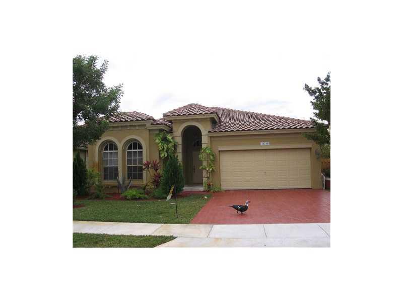 DESIRABLE GUARD GATED COMMUNITY, UPGRADED KITCHEN WITH GRANITE TOPS,PANTRY, LAUNDRY ROOM, FENCED BACK YARD , 4 BEDROOMS, 3 FULL BATHS, NEW RANGE AND REFRIGRATOR, VERY WELL KEPT COMMUNITY WITH POOL AND CLUBHOUSE AND EXERCISE ROOM, VERY CLOSE TO DADE COUNTY  AND HIGHWAYS.SHOPPING ETC.