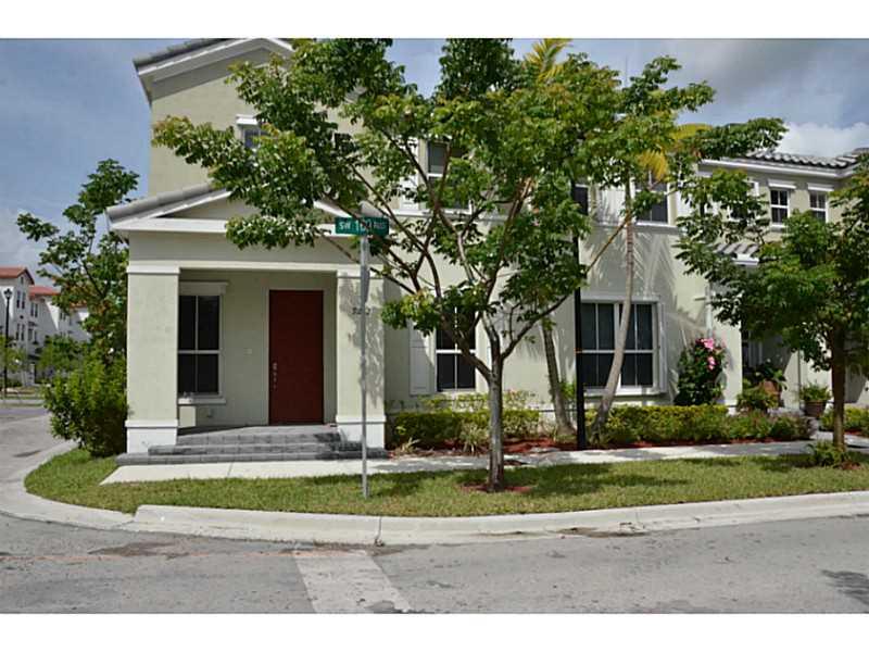 MUST SEE. Gorgeous Corner Townhome in the Newest Community at Kendall Square. 4 Bedroom 3 bathroom, 2 car garage. Granite counter tops, tile first floor, European wooden cabinetry. One Bed and One bath on the first floor. Close to schools, restaurants and  shops.