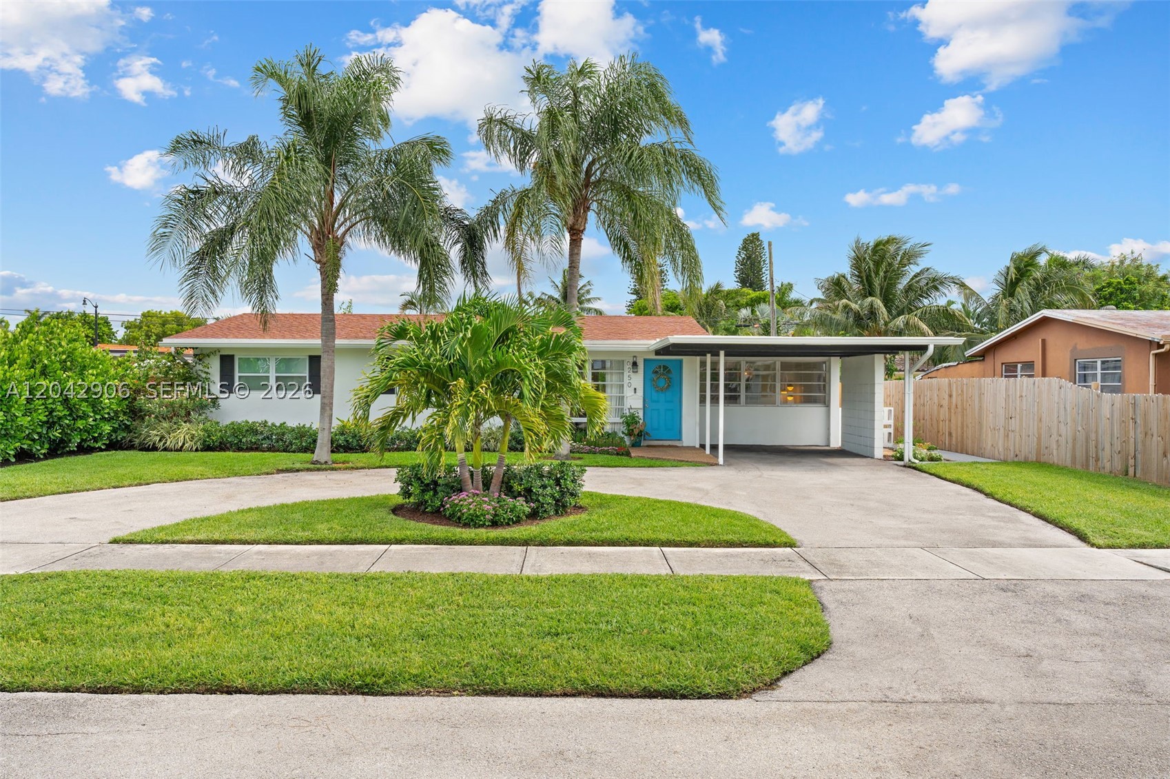 Renovated 3 bedroom 2 bathroom Pompano Beach home with a heated pool and covered outdoor living area, the perfect setting for relaxed outdoor living. The light filled interior has crisp terrazzo floors and renovated kitchen and bathrooms. Additional features include seven year old roof,  one car carport, circular driveway for plenty of parking, private back yard with synthetic turf and outdoor kitchen and laundry and storage room. Ideally located close to the beach, vibrant restaurants, shopping, and convenient highway access, this home offers an easy, sun soaked lifestyle in the heart of Pompano Beach.