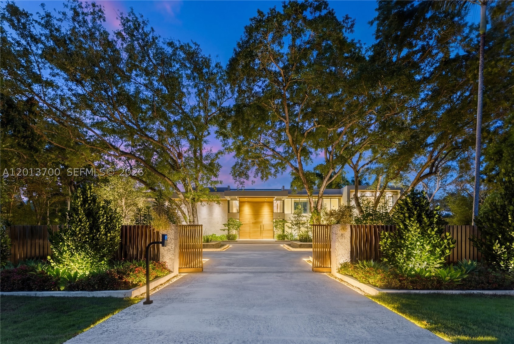 Crestpoint Estate represents a rare convergence of architecture, resort-scale amenity and artistic vision, privately set behind a parametric entrance on a 55,000+ square foot estate in the heart of Pinecrest. Spanning over 16,000 total square feet, the residence offers 7 bedrooms and 8.5 bathrooms, defined by a refined palette of oolite stone, cumaru wood, and venetian plaster.
A dramatic, LED-lit entry court sets the stage for arrival, leading to a grand double-height foyer anchored by a sculptural walnut floating staircase. Natural light defines the interiors, highlighted by a signature sloped skylight over the great room and a glass-lined corridor framed by lush tropical gardens, seamlessly blending indoor and outdoor living.
The Fendi-designed kitchen overlooks the expansive grounds, while the formal living and distinguished entertainment room features bespoke Hermès leather accents. Outdoors, a double-height cascading granite waterfall as a striking focal point alongside a sunken fire lounge, Sukabumi stone pool, putting green, and curated landscaping. Furnished by Artefacto, Crestpoint Estate offers a warm, fully turnkey residence designed for refined entertaining and everyday living.