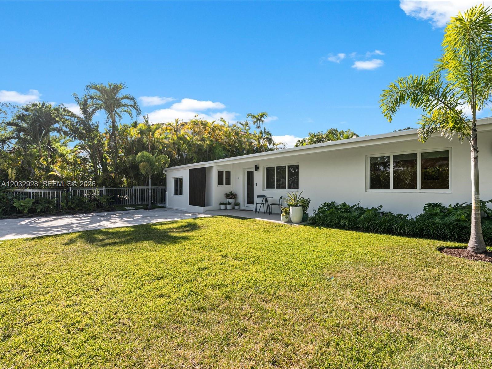 Tropical Creative Paradise in Keystone Point Welcome to a one-of-a-kind modern retreat in the exclusive 24-hour guard-gated community of Keystone Point. This fully renovated and beautifully furnished 4-bedroom, 3-bathroom residence blends luxury living with creative functionality in one of Miami’s most desirable waterfront neighborhoods. Designed for both comfort and inspiration, the home features a professionally designed, acoustically treated recording studio that also functions as a private movie theater — ideal for musicians, filmmakers, podcasters, or entertainment enthusiasts. A secondary studio/office adds flexibility for remote work or creative pursuits. The spacious primary suite offers a custom closet and spa-inspired bathroom, while a secondary bedroom includes its own en suite bath for added privacy. At the center of the home is a sleek chef’s kitchen with marble countertops and premium Italian Bertazzoni appliances. Smart-home features include Philips Hue lighting, Sonos audio throughout, security cameras, and full smart-home integration. Surrounded by lush tropical landscaping, this private oasis is just minutes from the beach and offers peaceful, walkable living in one of Miami’s most beautiful gated neighborhoods. Ideally located less than 10 minutes from Bal Harbour Shops and beaches, and about 30 minutes from both MIA and FLL airports. A rare opportunity to live, create, and entertain in a fully turnkey tropical modern masterpiece.