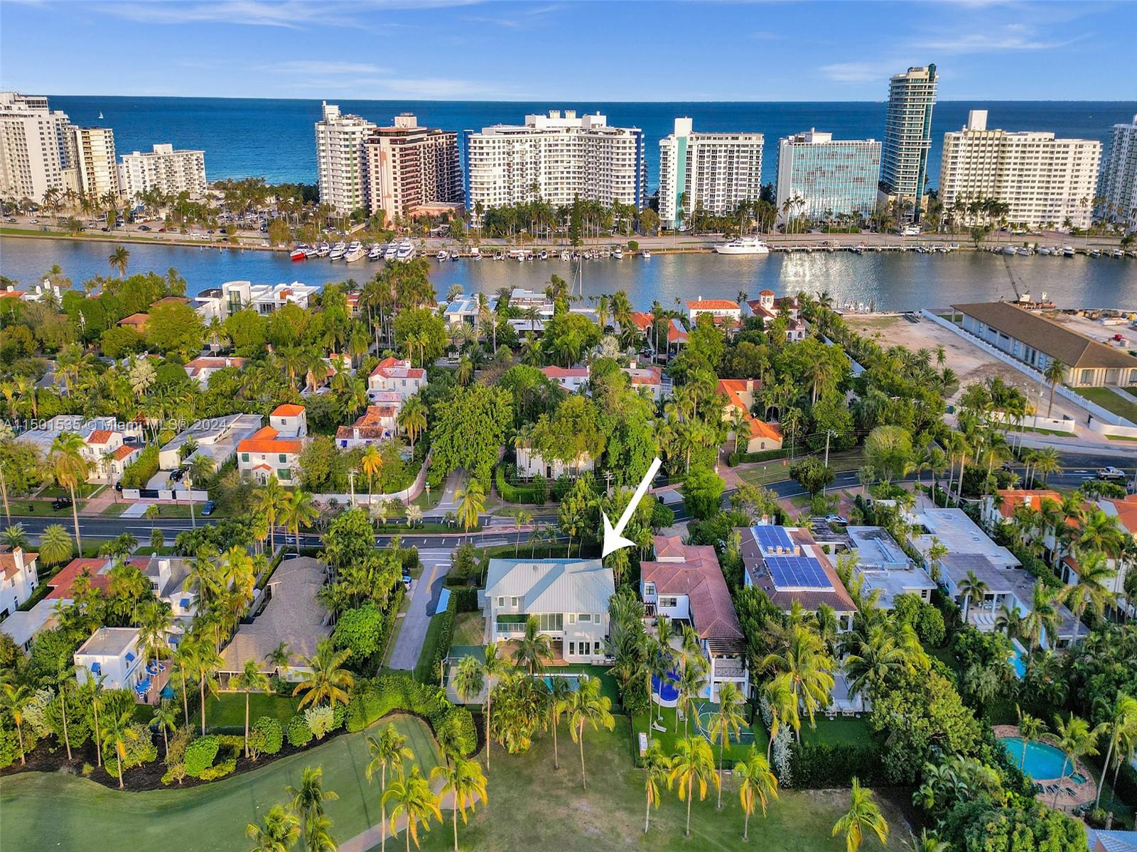 This breathtaking 4BR (possible 5BR), 3.5 bath, over 5200 total SFT new construction (2015, renovated 2024) contemporary masterpiece sits on 1/4 acre corner lot with high ceilings thru-out & boasts an impressive open floor plan entertainers delight! The veranda in the primary offers stunning views of the skyline, providing a picturesque backdrop for your morning coffee & luscious sunsets with a glass of wine. Living room has large windows that showcase the backyard oasis. Gourmet Italian kitchen features massive island & Thermador appls. The exterior of the home is equally impressive, with lush landscaping, private covered deck/patio, heated pool, & outdoor BBQ kitchen. Safe & tree-lined neighborhood, this smartly designed home sits on La Gorce Country Club providing a peaceful ambiance!!