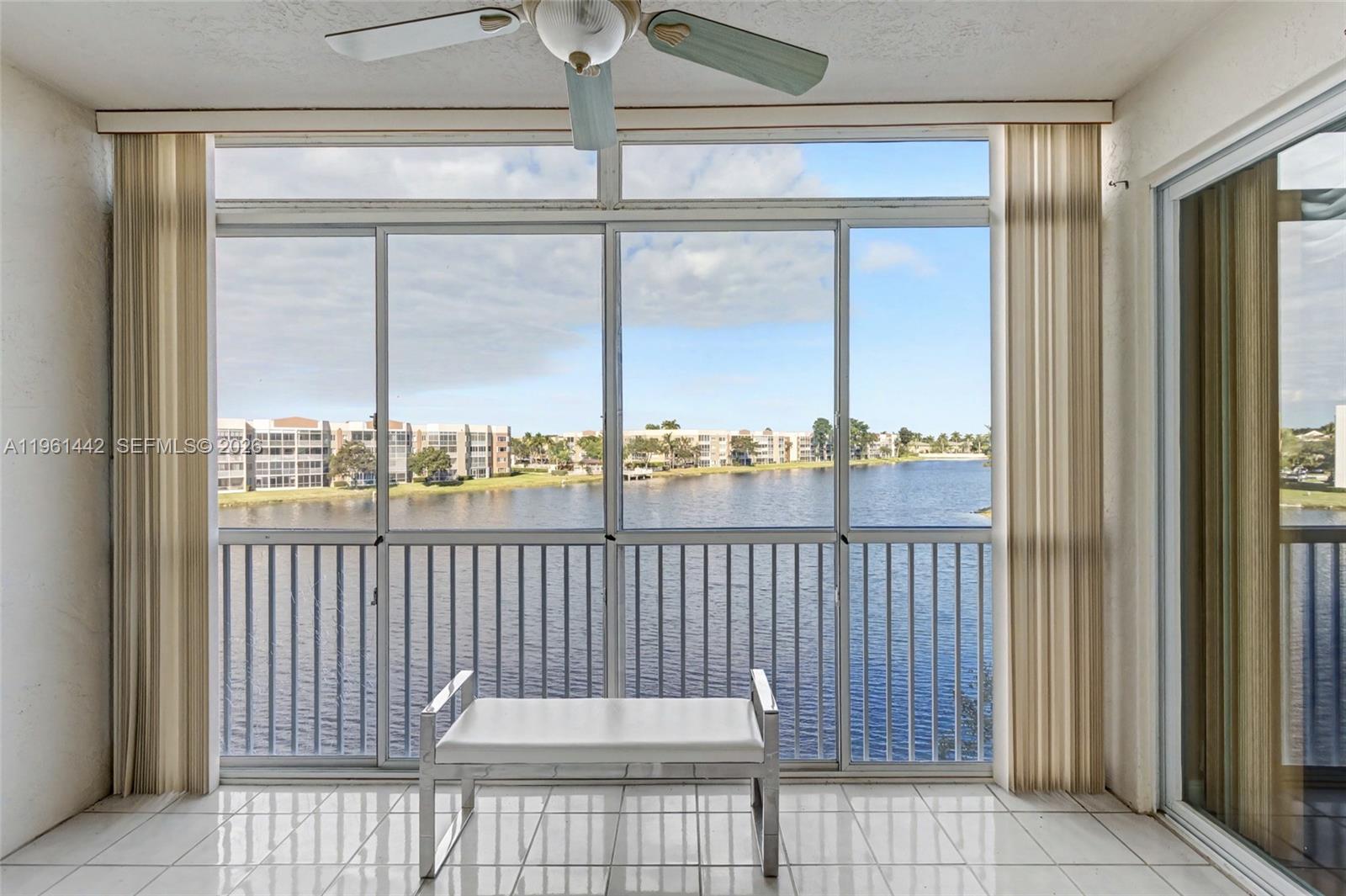 Large 2 bed/2 bath 1705 sq. ft Victoria model with gorgeous lake views from your screened balcony with acrylic sliders. Located close to elevator. Large kitchen with breakfast area. Additional enclosed room can be used as guest room or office. New A/C installed last year. Custom cabinetry built in primary walk in closet. Primary has ensuite with relaxing roman soaker tub and separate shower in primary. Hurricane impact windows and doors throughout for your protection. Clubhouse deed paid in full and association says 55+. Amenities include pickleball, tennis, 60+ clubs, gym, shuttle bus, indoor/outdoor pool, fitness classes and much more! 20% down required, credit score 700 and income $36K single and $50K couple.