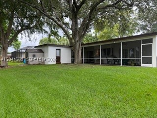 Welcome home to this beauty located in the highly desirable community of Cooper City, known for top rated schools, and family friendly atmosphere. The spacious layout features a formal living/dining room with abundant natural light, and a great flow for everyday living and entertaining.  Well appointed  kitchen with real wood cabinets, pantry, granite countertops, stainless appliances, pass through window to screened porch, breakfast bar, and family room that overlooks large backyard with peaceful view of water, ideal for relaxing. Primary bedroom has walk in closet, ensuite modern bathroom with exit door to screened porch.  Converted garage is a versatile room with closet, perfect for guest room, home office or den. Generously sized laundry room, and storage area. Upgraded laminate and ceramic tile floors throughout. Shown by appointment, call today for a private tour.