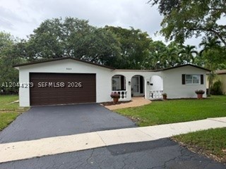Welcome home to this beauty located in the highly desirable community of Cooper City, known for top rated schools, and family friendly atmosphere. The spacious layout features a formal living/dining room with abundant natural light, and a great flow for everyday living and entertaining.  Well appointed  kitchen with real wood cabinets, pantry, granite countertops, stainless appliances, pass through window to screened porch, breakfast bar, and family room that overlooks large backyard with peaceful view of water, ideal for relaxing. Primary bedroom has walk in closet, ensuite modern bathroom with exit door to screened porch.  Converted garage is a versatile room with closet, perfect for guest room, home office or den. Generously sized laundry room, and storage area. Upgraded laminate and ceramic tile floors throughout. Shown by appointment, call today for a private tour.