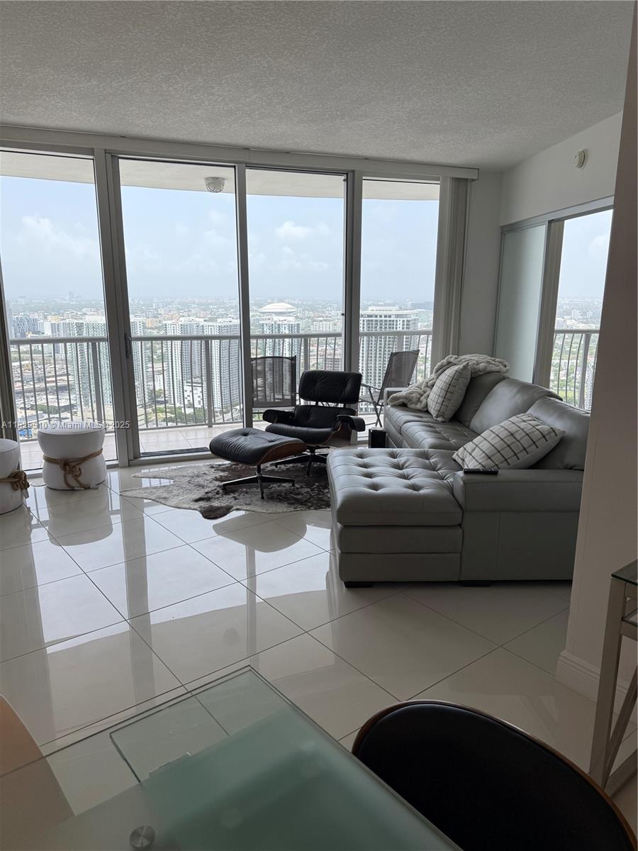 Enjoy one of the best bays views in the area from this beautifully furnished and fully equipped 2- bedroom, 2 bath condo. Featuring sleek tile floors, a spacious layout, and modern upgrades including a wine cooler, this home is move-in ready or perfect as a short-term rental (30-day minimum, subject to association approval).The primary bedroom offers a queen bed, a generous closet, and a tub/shower combo for added comfort. Includes one assigned parking spot. Located in an A+ location directly across from Margaret Pace Park and top dining spots like Klaw and CasaDonna. You're just 15 minutes from South Beach and surrounded by fantastic amenities including a gym, BBQ area and more. Whether you're looking to invest, rent, or live in luxury this unit is a rare find.