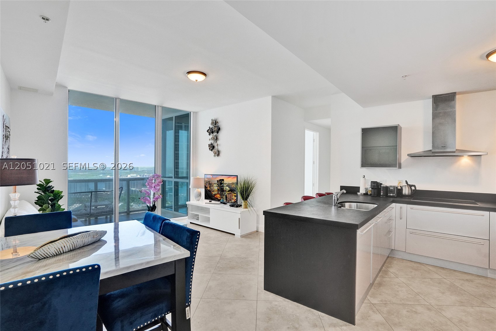 Experience elevated coastal living. Perched high above the shoreline, this exceptional residence showcases sweeping ocean and city skyline views through dramatic floor-to-ceiling windows that fill the home with natural light. The thoughtfully designed open-concept floor plan seamlessly blends style and comfort, while the contemporary chef’s kitchen features premium appliances and sophisticated finishes. Indulge in a world-class lifestyle with exclusive resort-style amenities, including a stunning oceanfront pool, private beach access, and 24-hour concierge service. Ideally situated just moments from renowned dining, luxury shopping, and vibrant entertainment, this residence offers the perfect combination of elegance, comfort, and convenience in one of South Florida’s most desirable beachfront destinations.