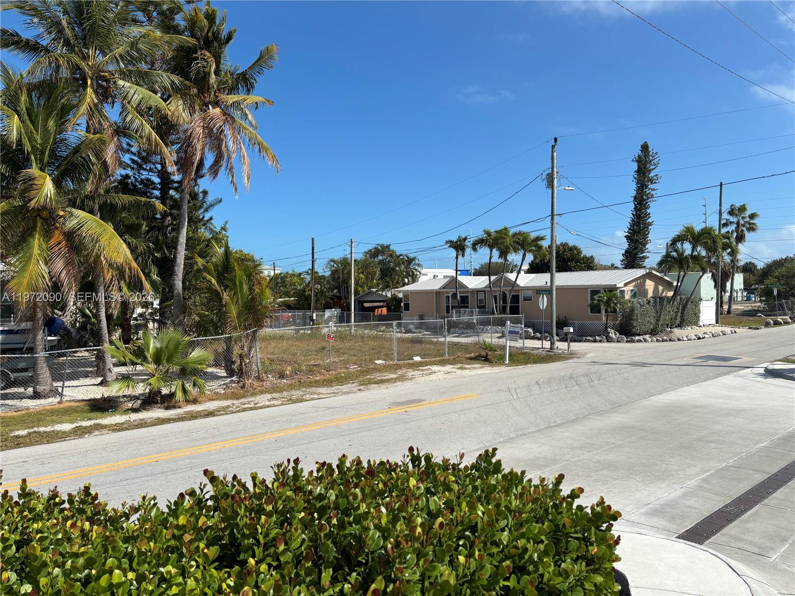 Seller Financing Available -- Prime Corner Lot with water views, in Marathon
This vacant, cleared corner lot sits in one of Marathon's most convenient and high-visibility locations. Directly across from Racetrac, the public library, Marathon High School, Fishermen's Hospital, Starbucks, mini golf, City Marina, the boat ramp, and the events park, this property offers unbeatable access to the best of the Middle Keys.
Whether you're looking to build, invest, or secure a strategic commercial or mixed-use opportunity, this lot places you at the center of Marathon's activity hub.
Seller financing makes this an even more accessible opportunity.
